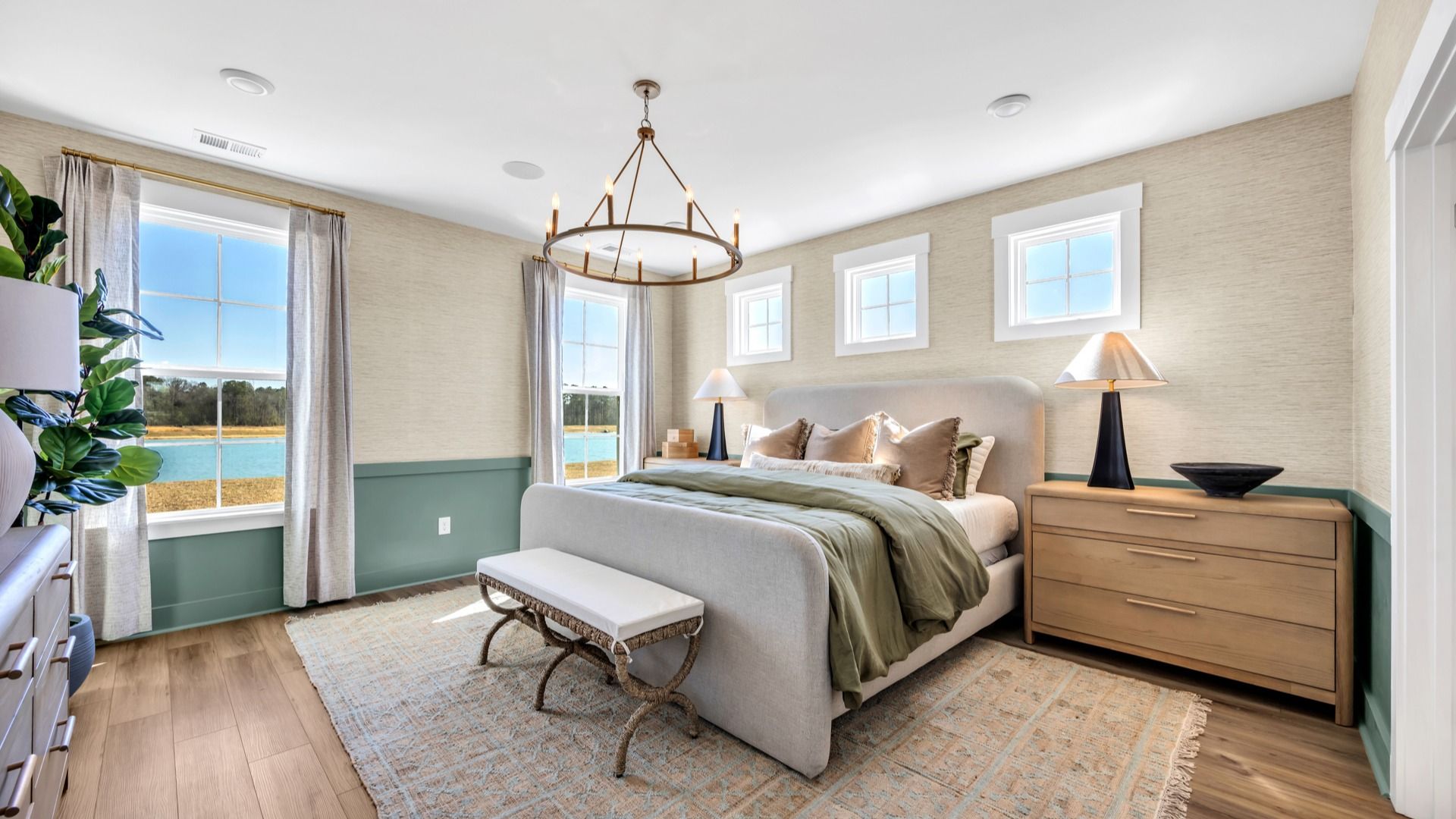 Premium primary bedroom in Chestnut Farms in by DRB homes offering wood floors and lots of natural light