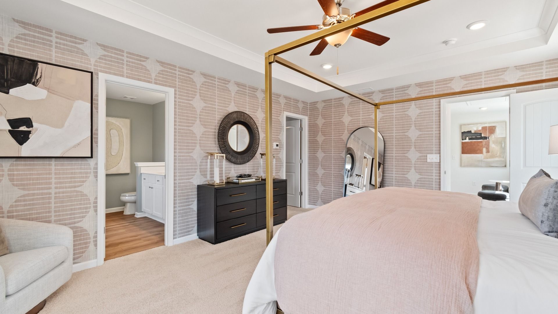 Open Austin Alternate primary suite with carpet flooring, seating area, and connected bath at Bowers Farm Townhomes.