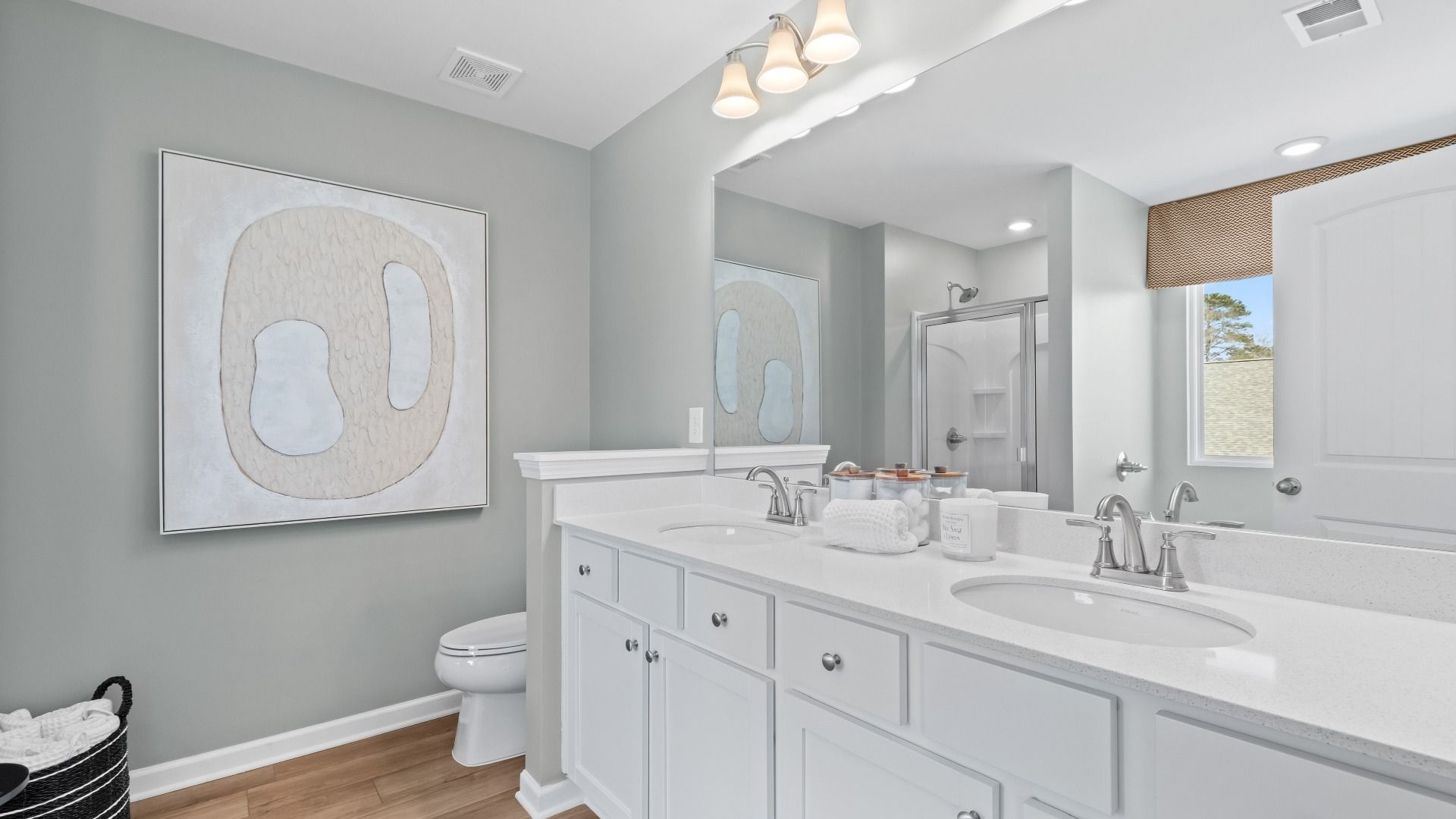 Austin Alternate primary bath with dual vanities and neutral finishes at Bowers Farm Townhomes.