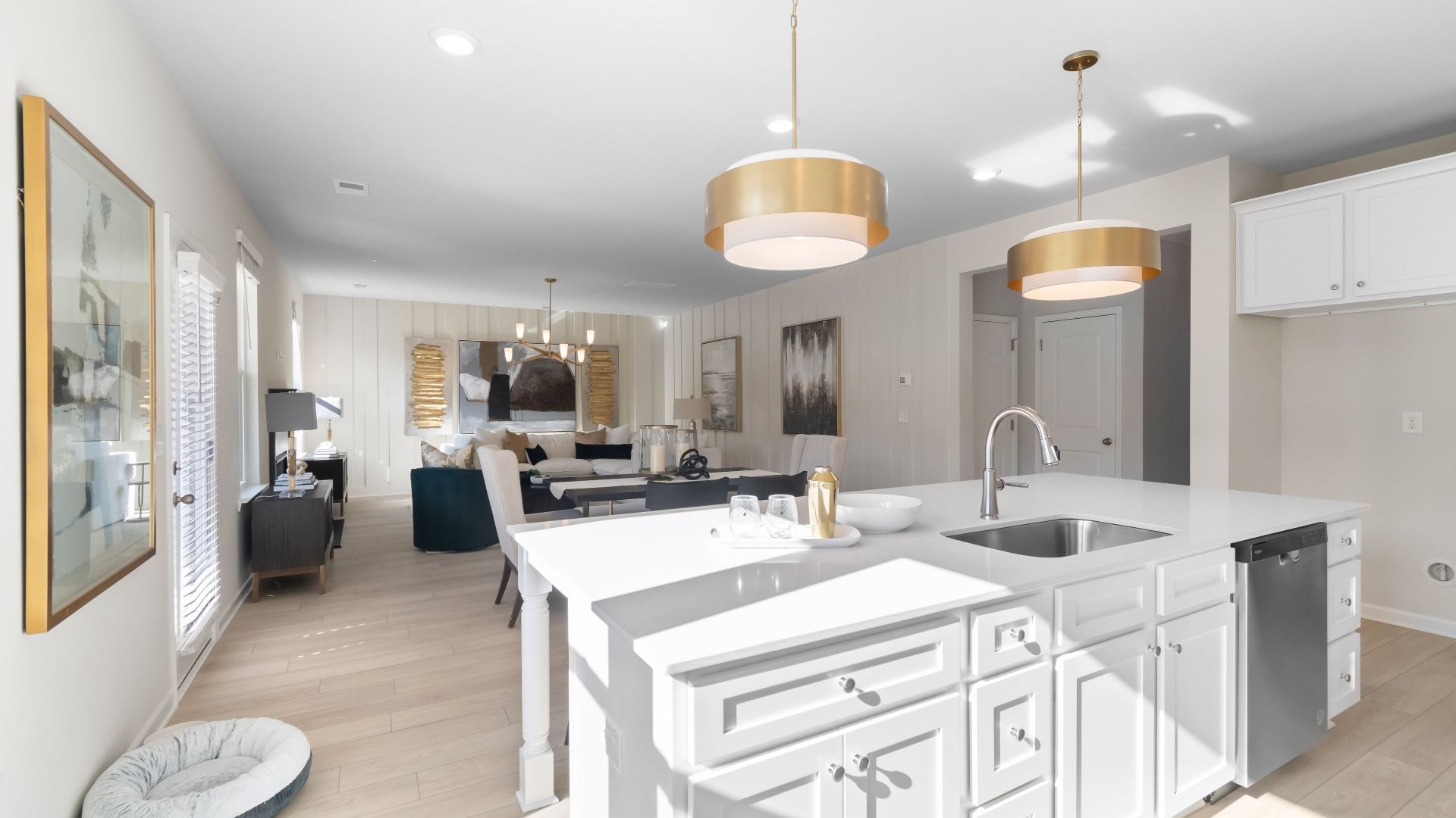 Ridgewood open-concept first floor with kitchen island overlooking spacious breakfast area and family room at Burchwood.