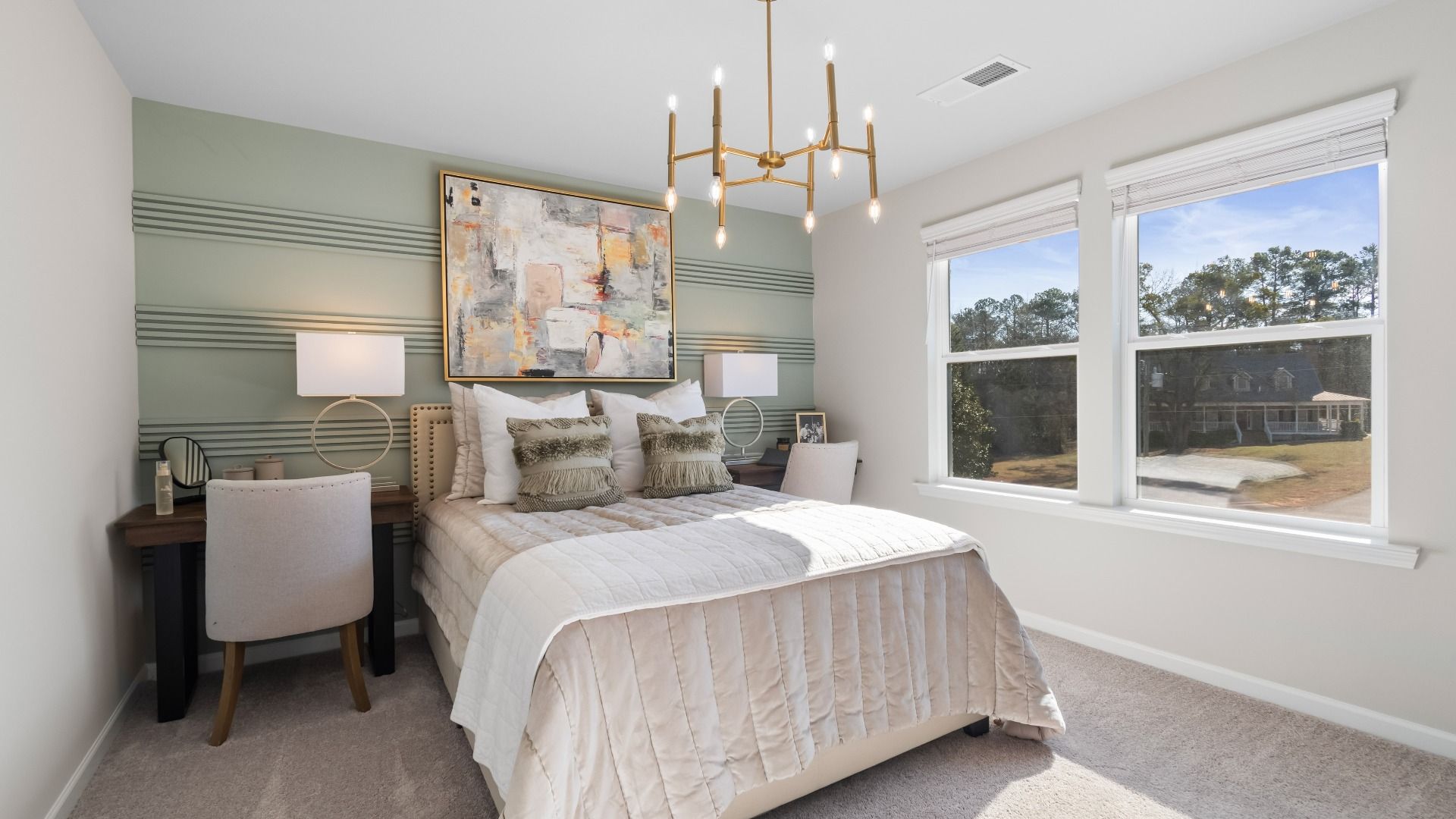Secondary bedroom with carpet flooring and windows providing natural light in the Ridgewood at Burchwood in Stockbridge, GA.