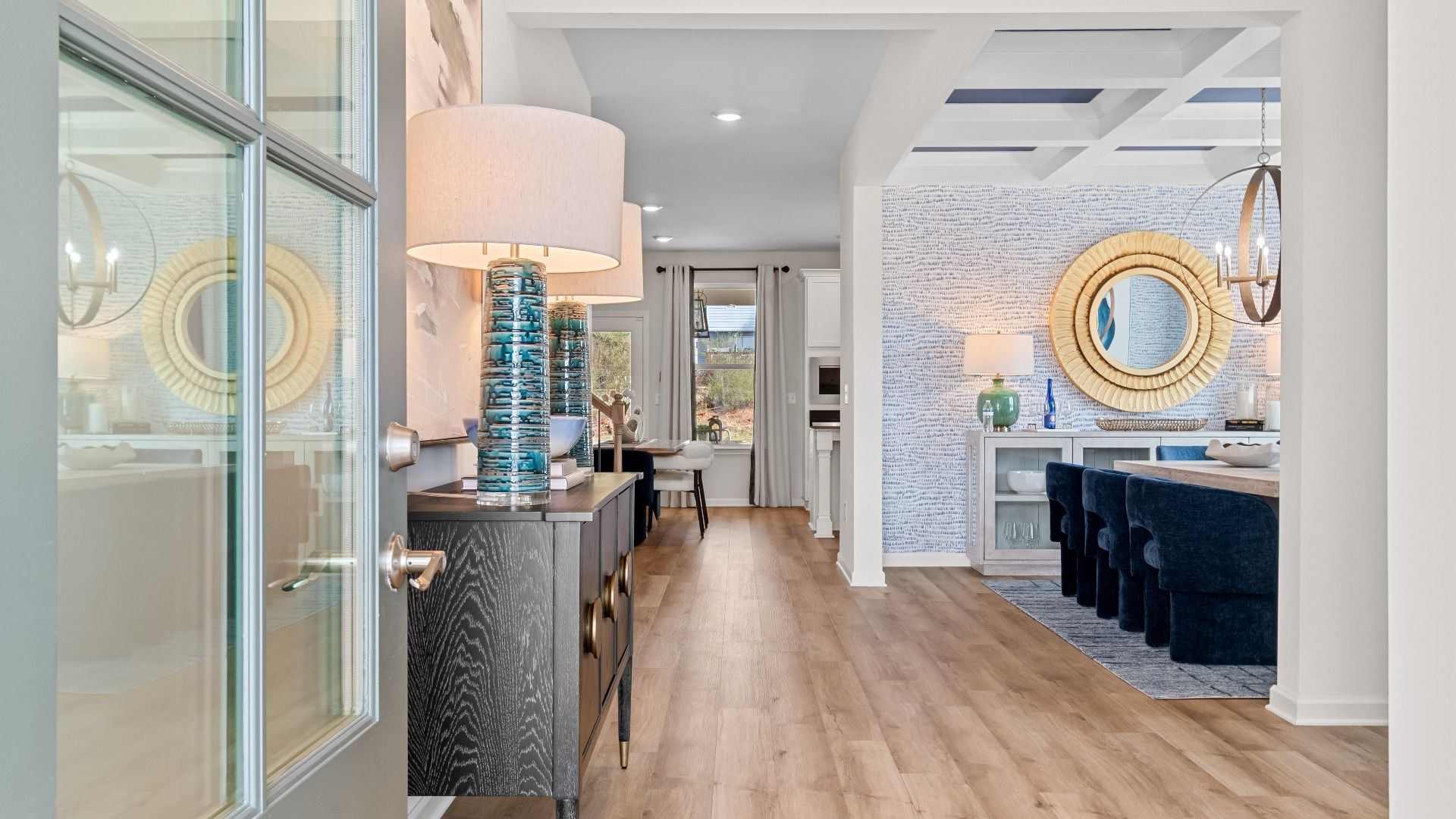Wynwood entryway to open foyer with view to dining room and LVP flooring at Bowers Farm in McDonough, GA.