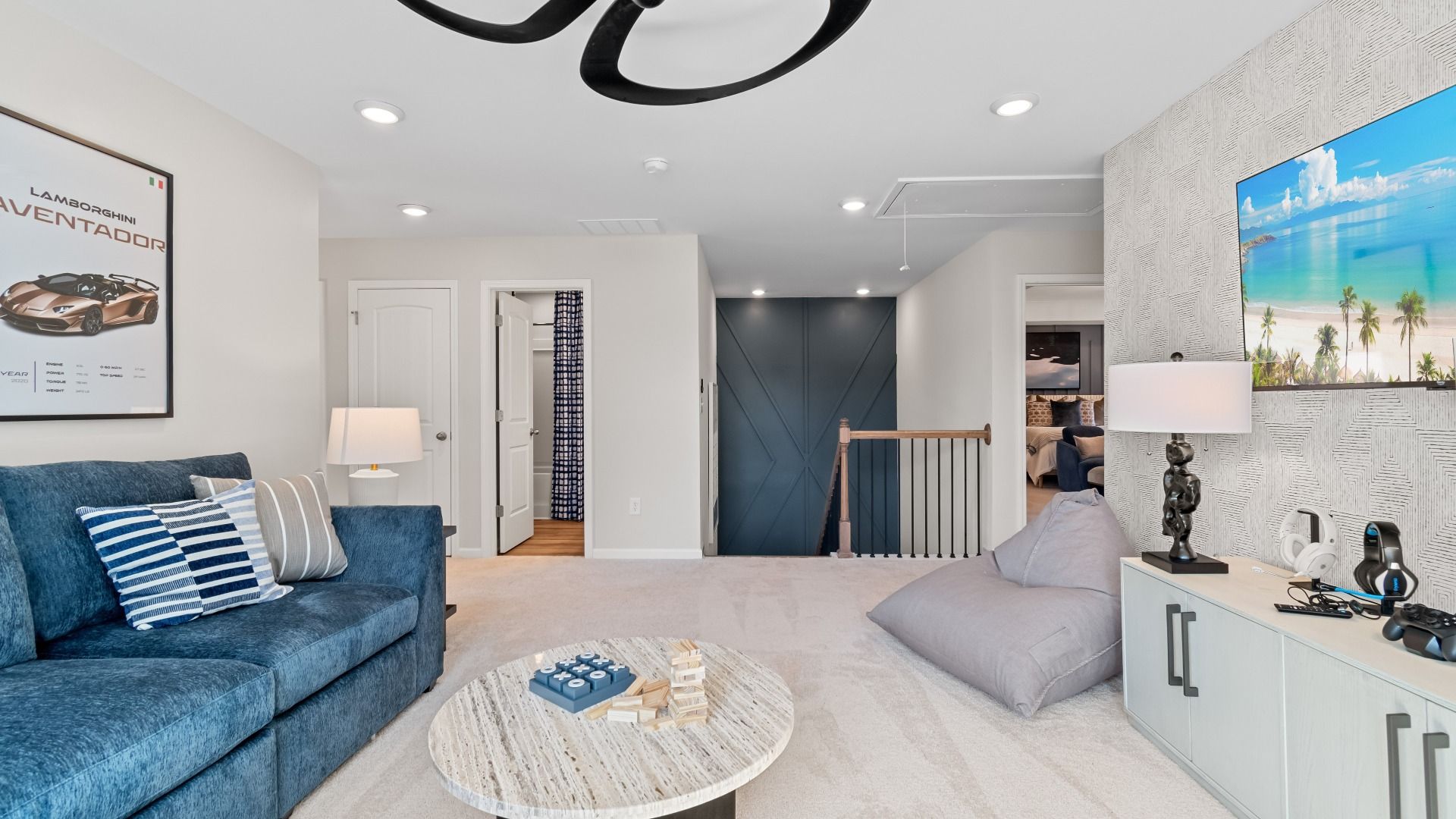 Spacious open Wynwood loft for versatile use with carpet flooring and natural light at Bowers Farm in McDonough, GA.