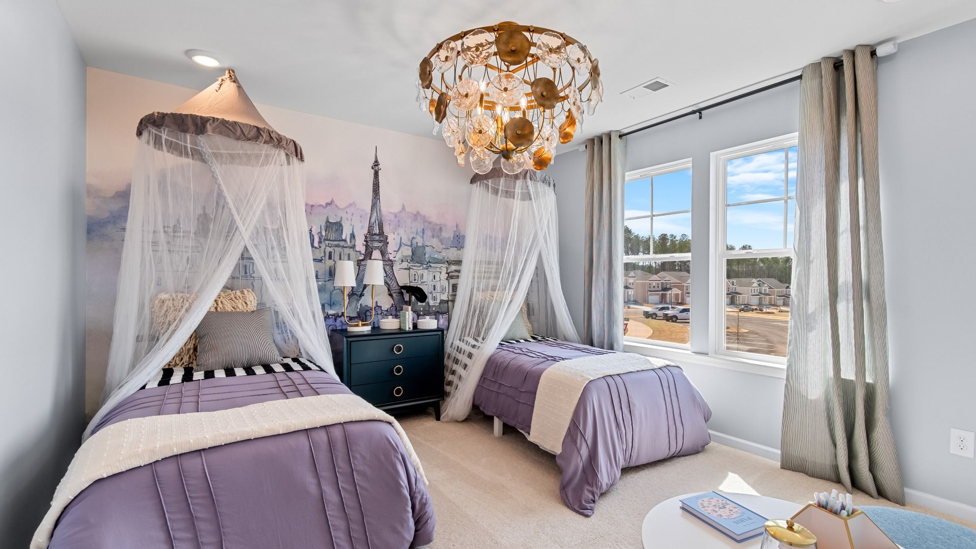 Comfortably sized secondary bedroom with neutral palette, carpet flooring, and natural light in the Wynwood at Bowers Farm.