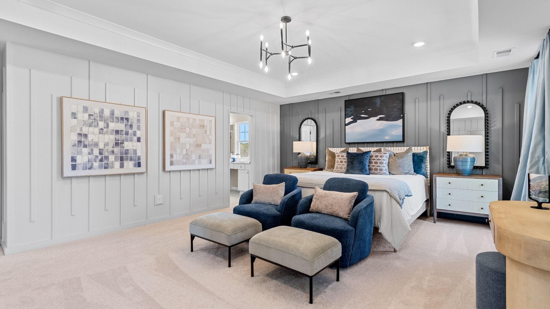 Grand Wynwood primary suite with modern features, tray ceiling, and carpet flooring at Bowers farm in McDonough, GA.