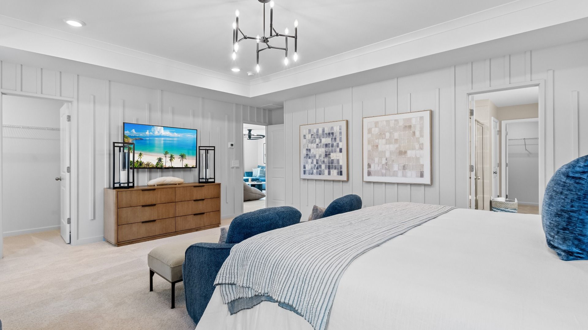 Spacious Wynwood primary suite with carpet flooring, double closets, and connecting bath at Bowers Farm in McDonough, GA.