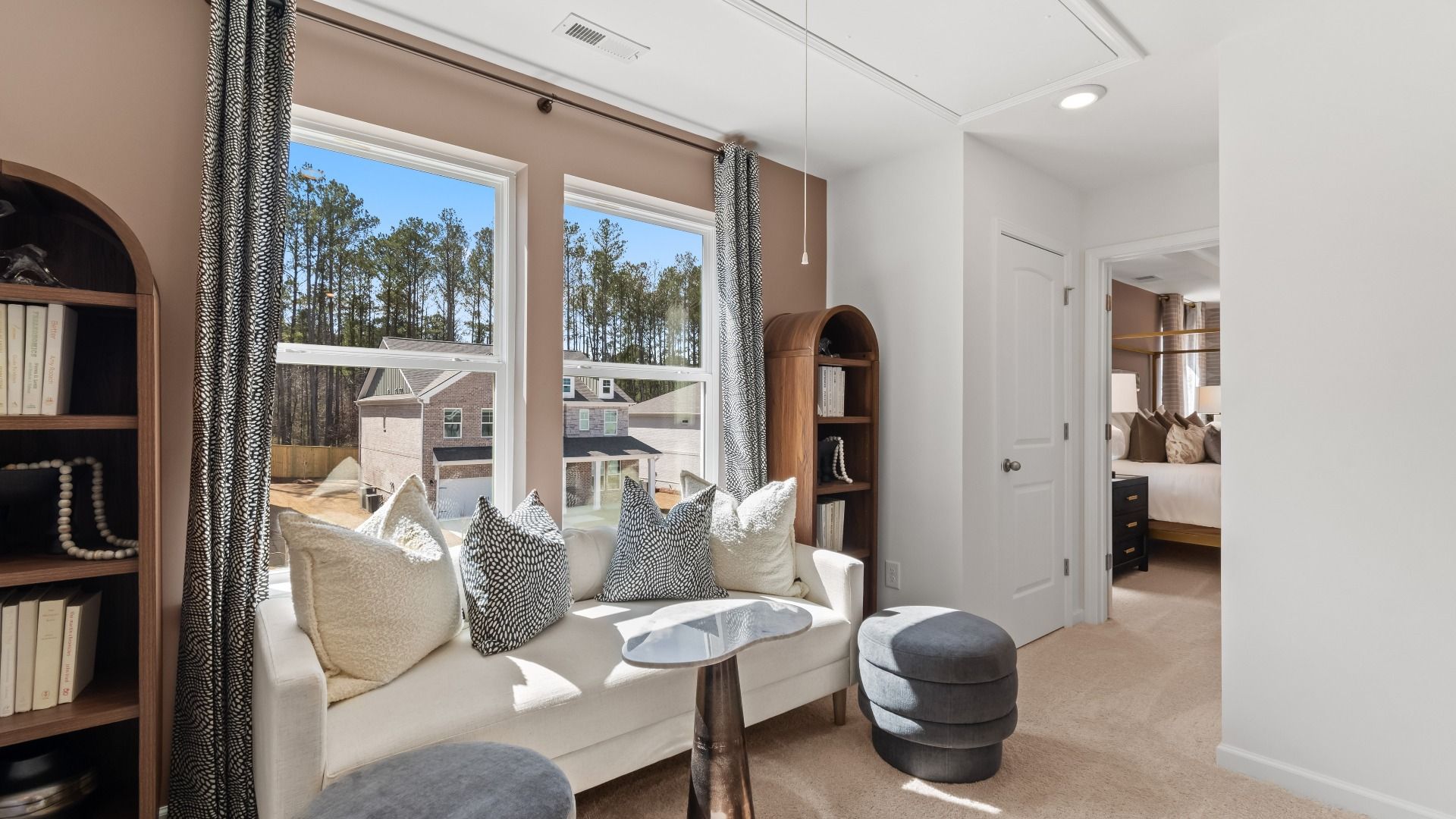 Upstairs loft with expansive windows and open flexible living space in new construction single family home at Bowers Farm.