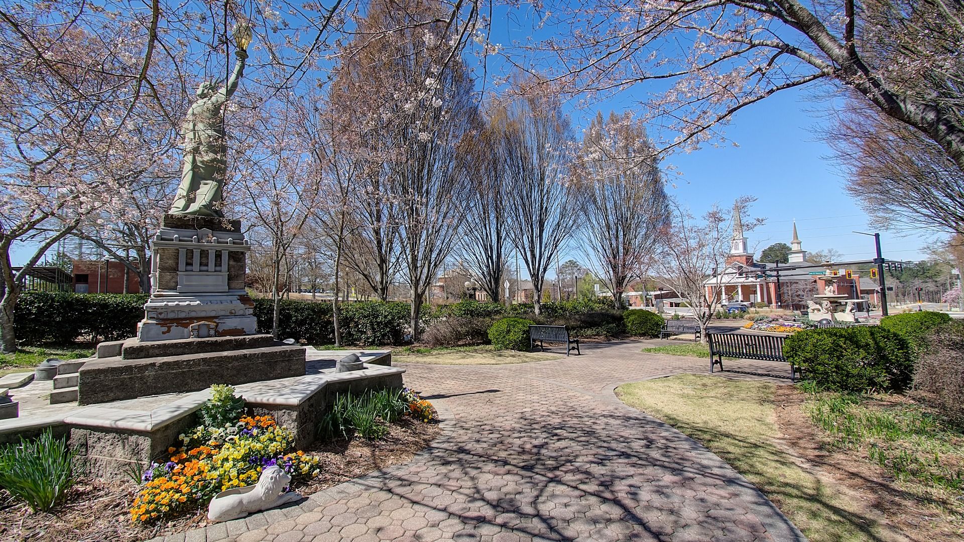 Municipal park with open walking paths, public seating, and historical charm near Burchwood community in Stockbridge, GA.