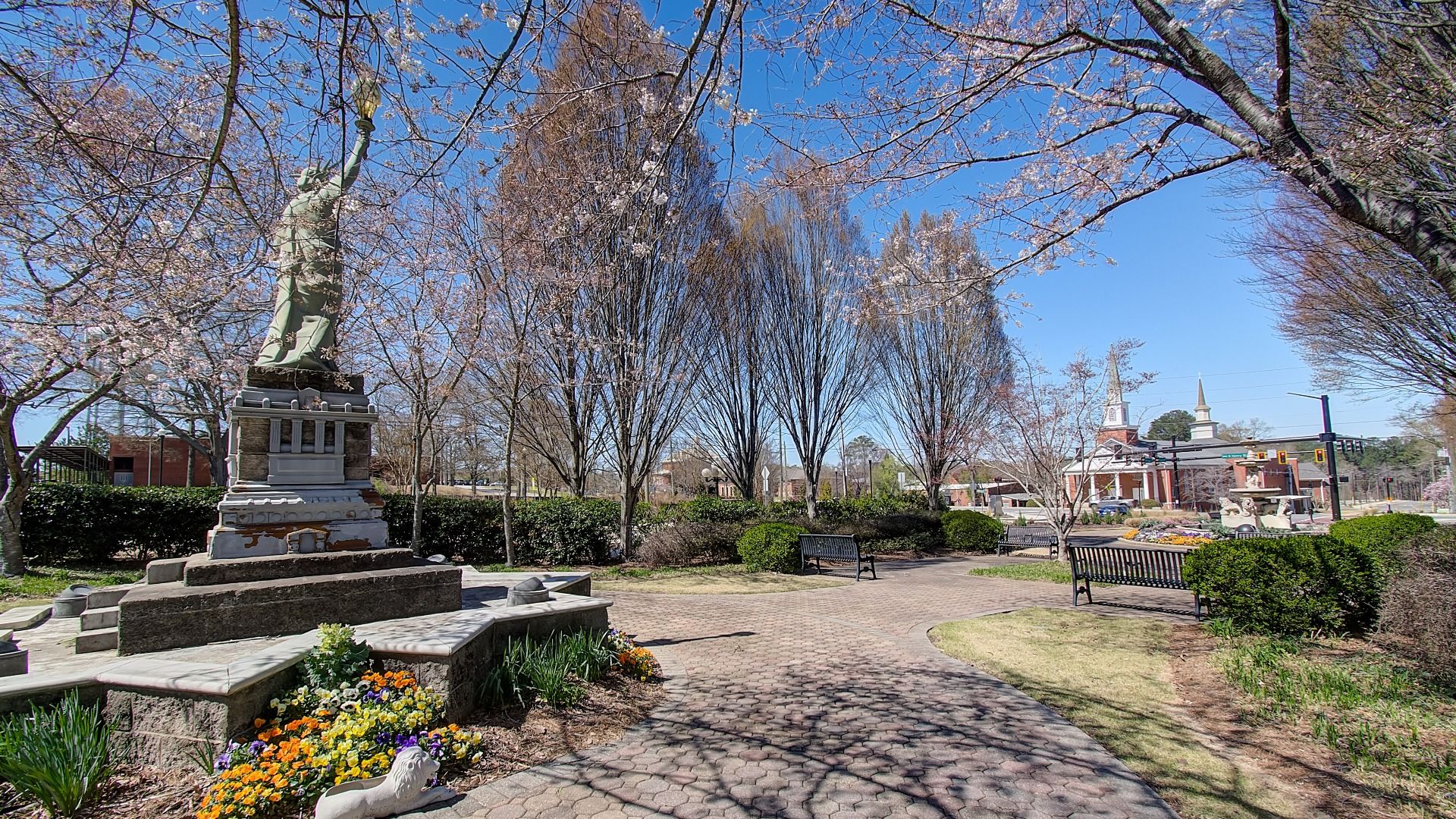 Municipal park with open walking paths, public seating, and historical charm near Diamante community in Stockbridge, GA.