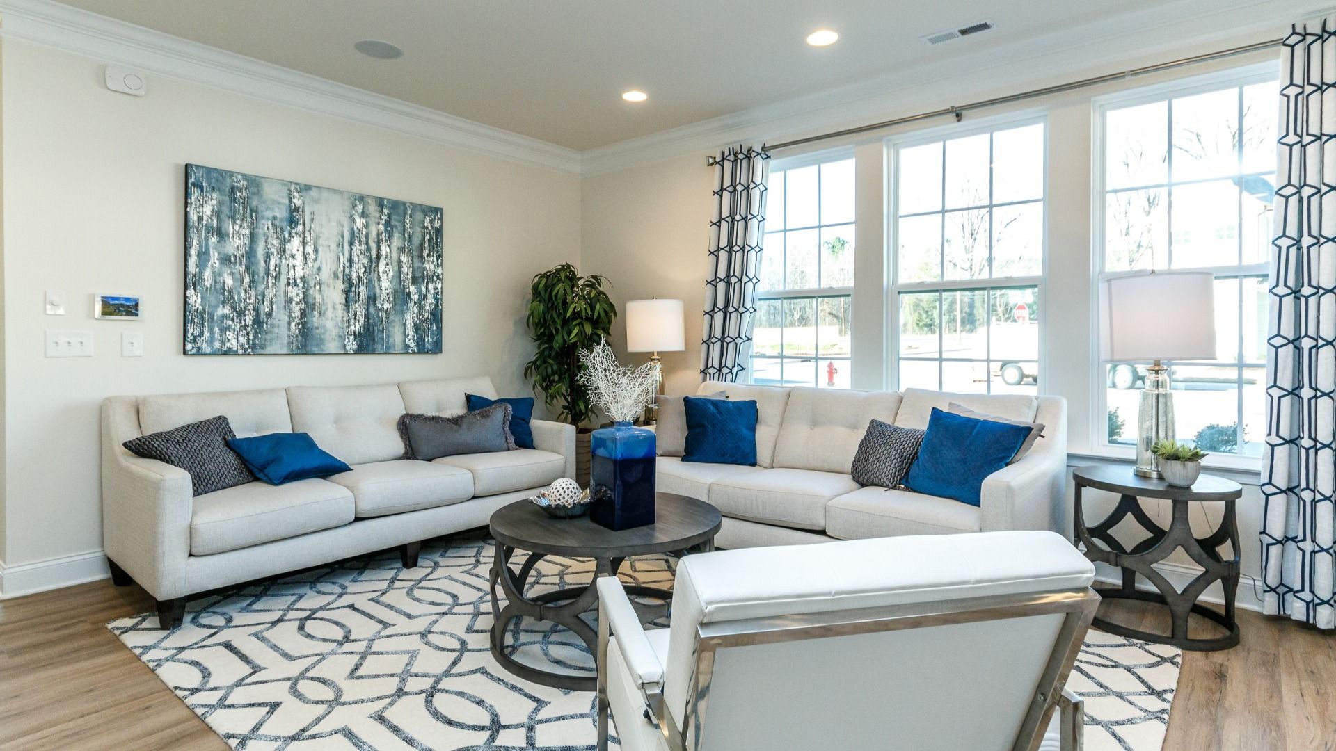 Spacious family room with large windows and premium finishes in the Litchfield Plan at Bell Glen by DRB Homes Charlotte, NC