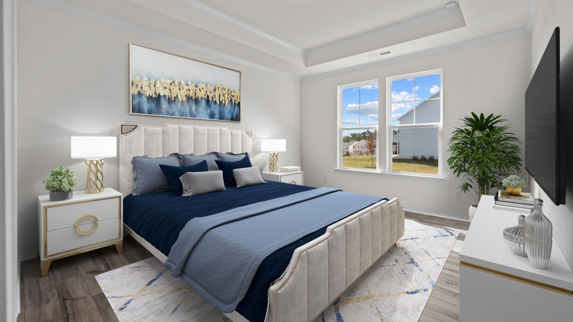 Bedroom with raised tray ceiling and large window in the Fairfield Design by DRB Homes in Mooresville, NC