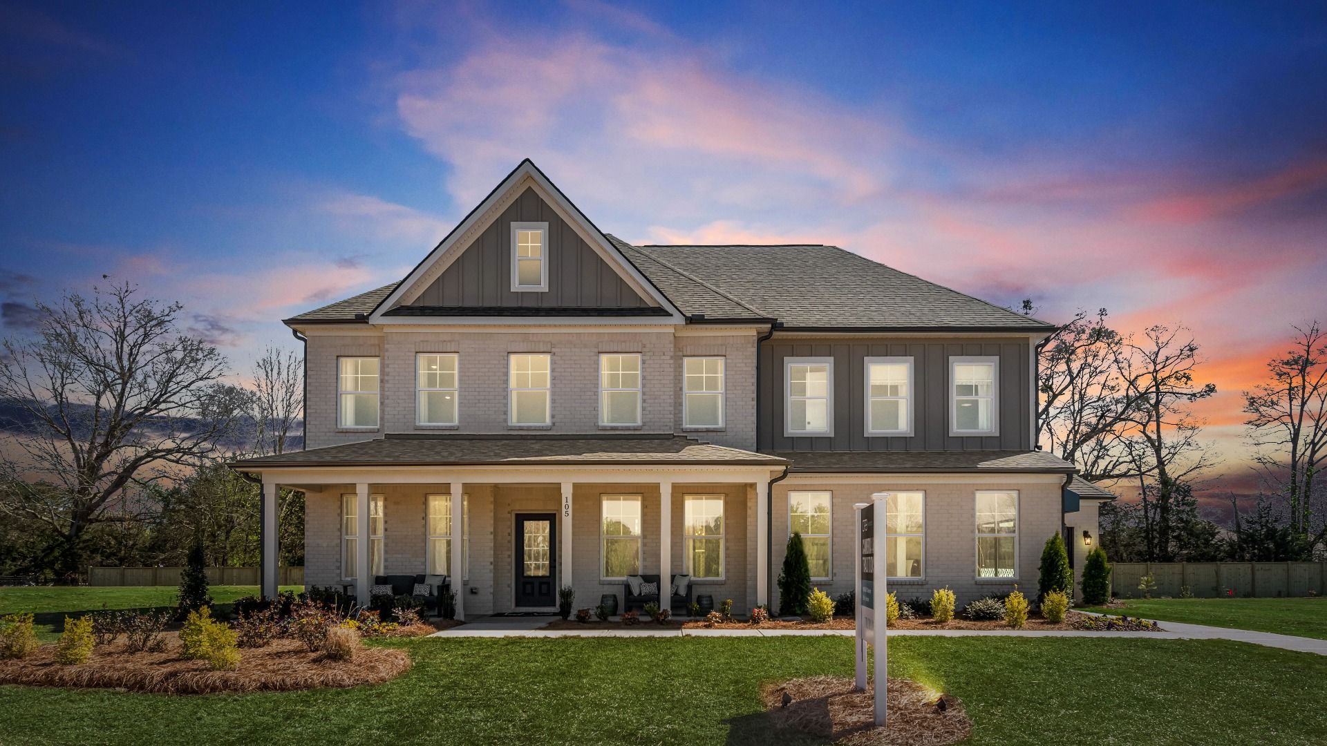 Modern exterior of the Stonefield model featuring side-entry garage, and covered porch and entry in Hampton, GA.