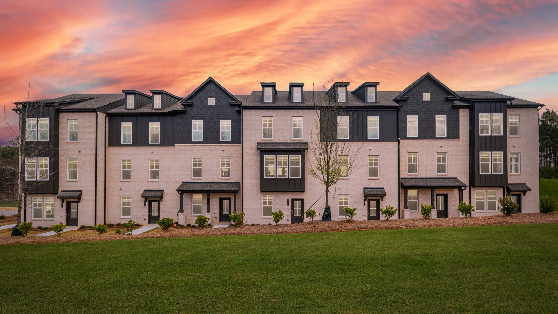 Modern three-story new construction townhomes with abundant yard space at Daybreak in Newnan, GA.