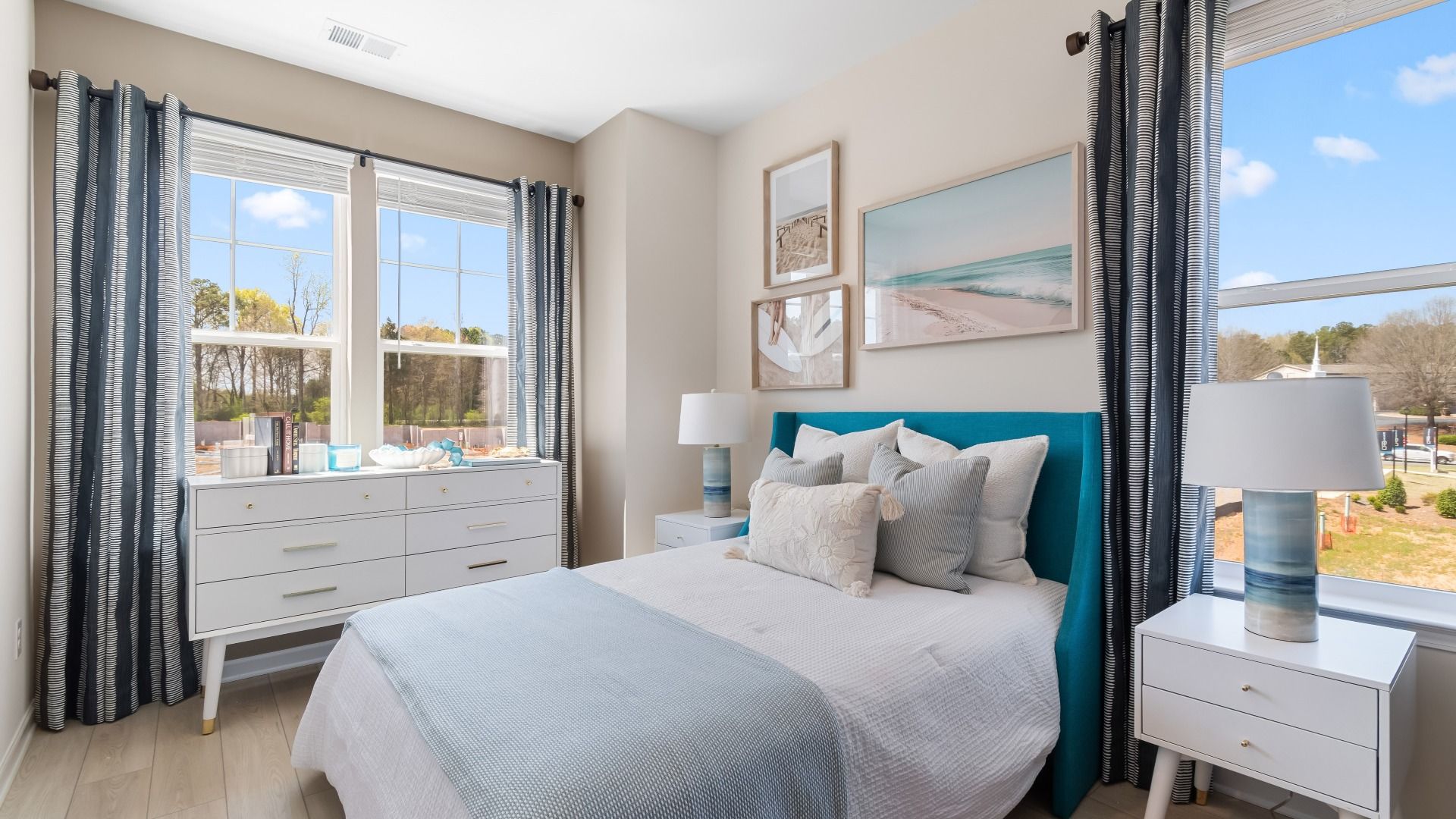 Comfortable secondary bedroom with neutral finishes and natural light at Daybreak in Newnan, GA.