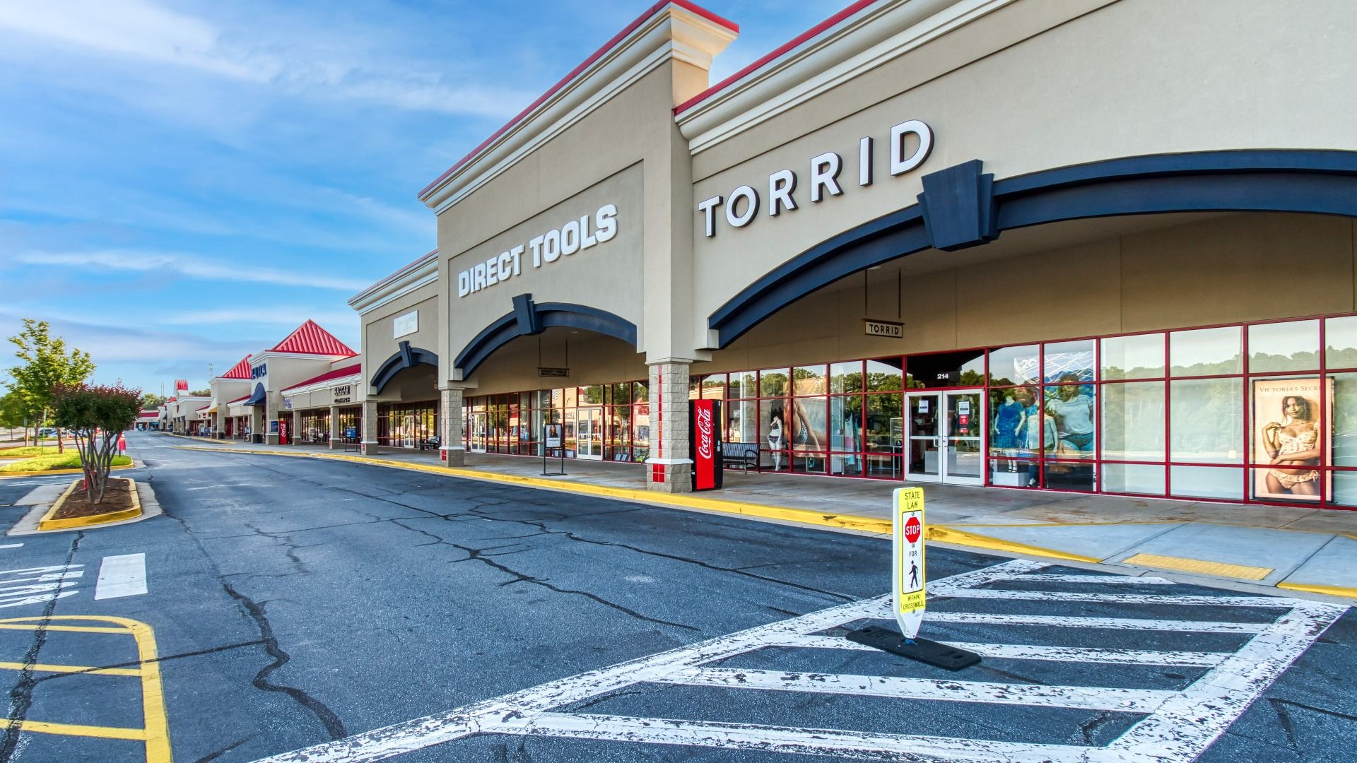 Walkable strip of Tanger Outlets outdoor mall with a variety of shops near The Park at Brighton in Locust Grove, GA.