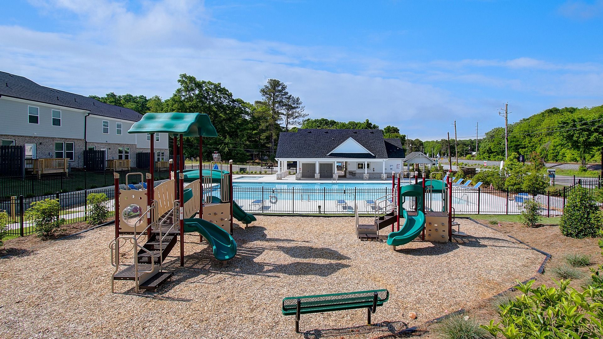 Playground at Diamante with mulch ground cover, multi-age play structures, and bench seating in Stockbridge, GA.