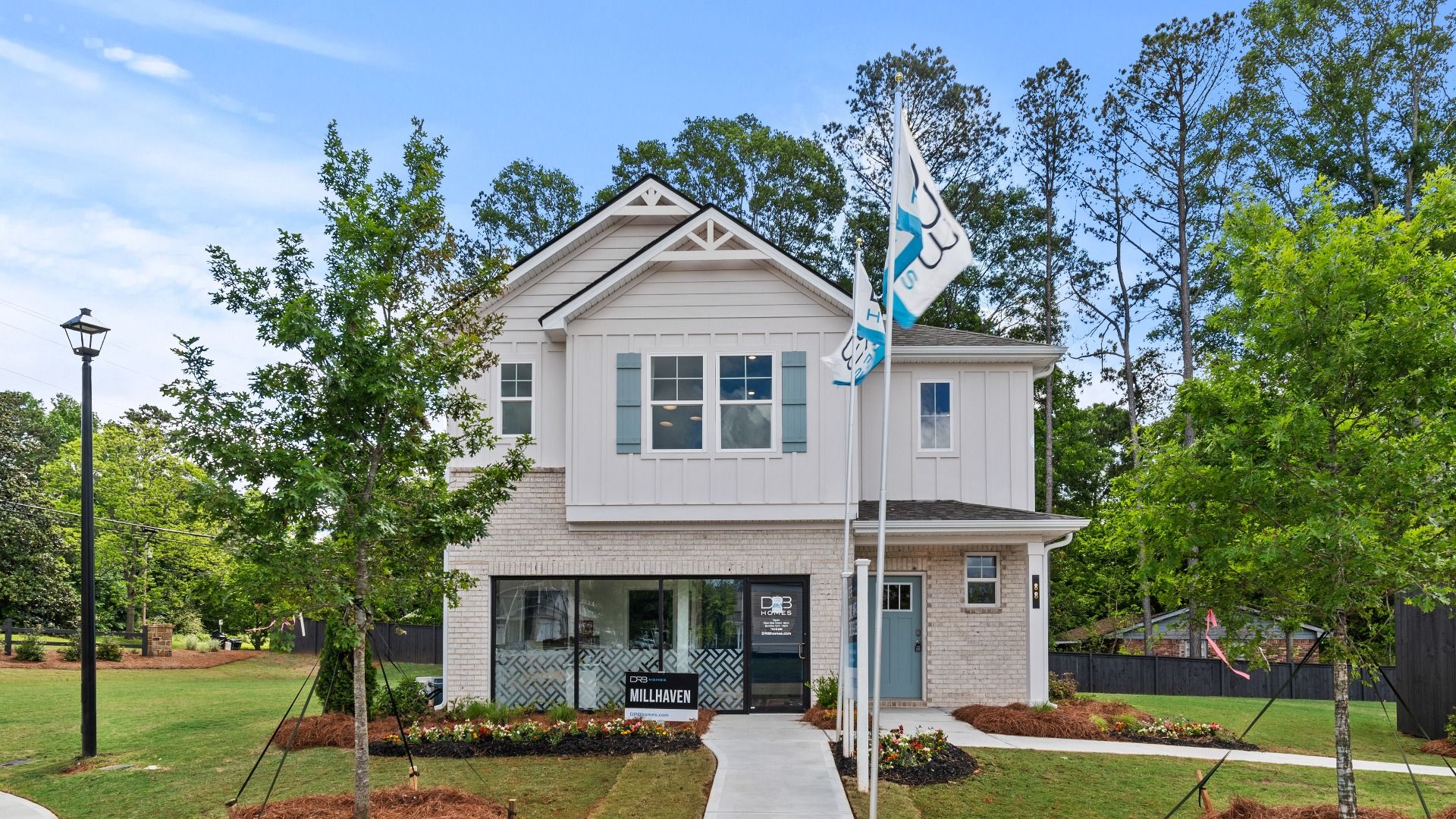 Millhaven two-story model home exterior at Enclave at Evergreen featuring modern design in Fairburn, GA.