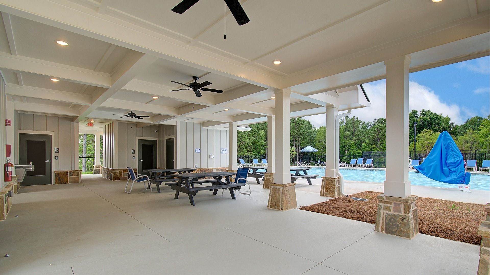Community covered pavilion with poolside picnic tables at Kingston in Locust Grove, GA.