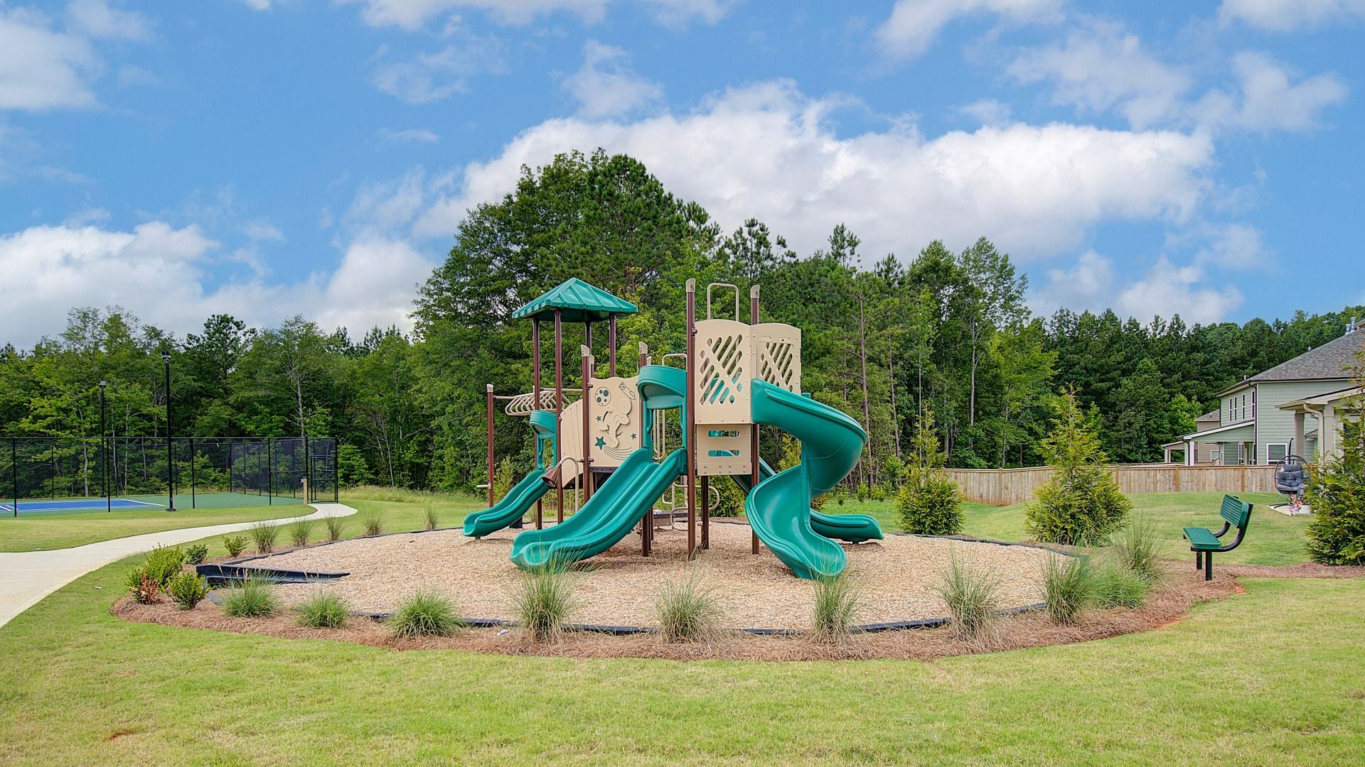 Outdoor community playground with slides and climbing features at Kingston in Locust Grove, GA.