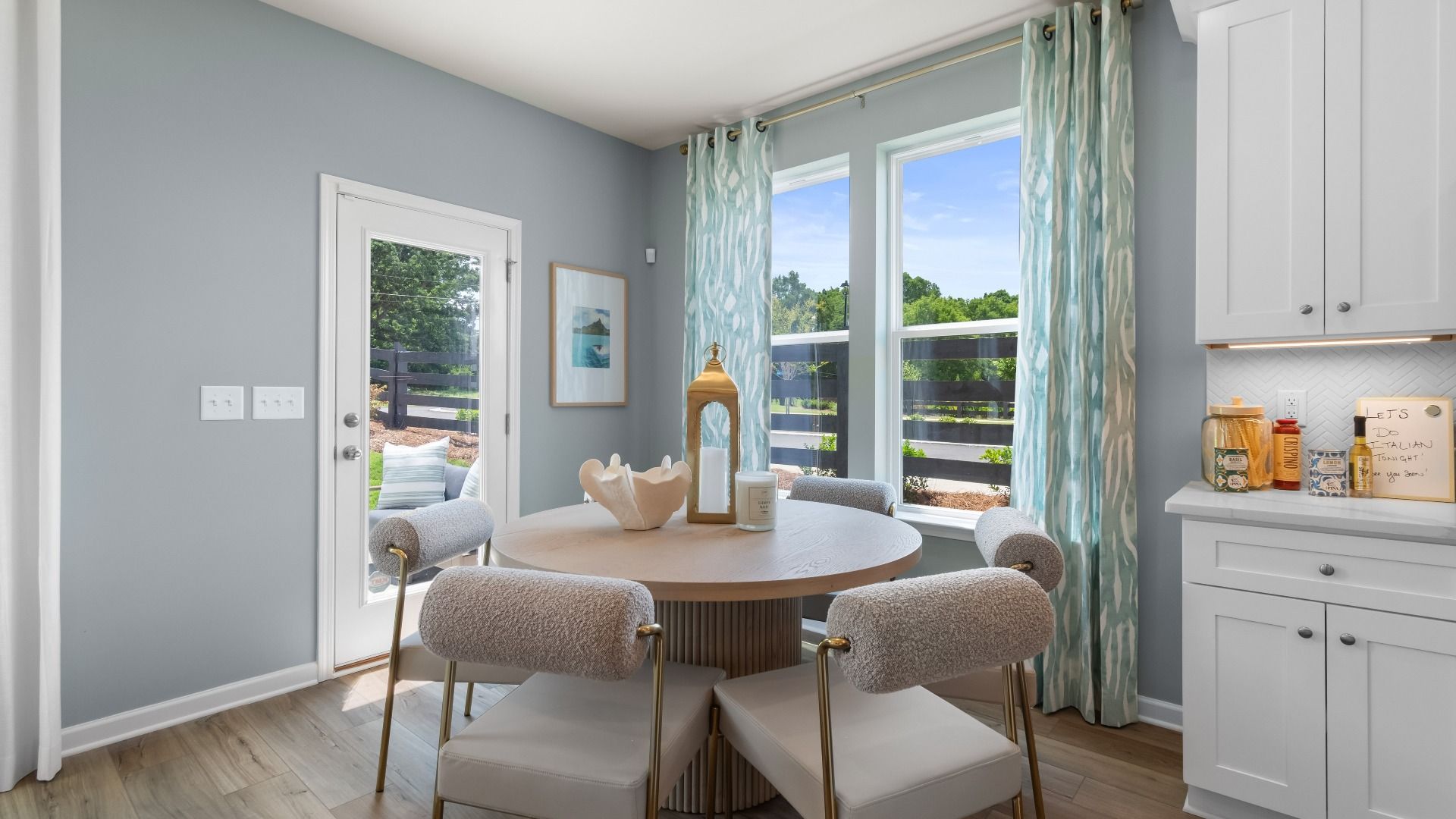 Bright breakfast area in new construction townhome featuring large windows and abundant natural light.