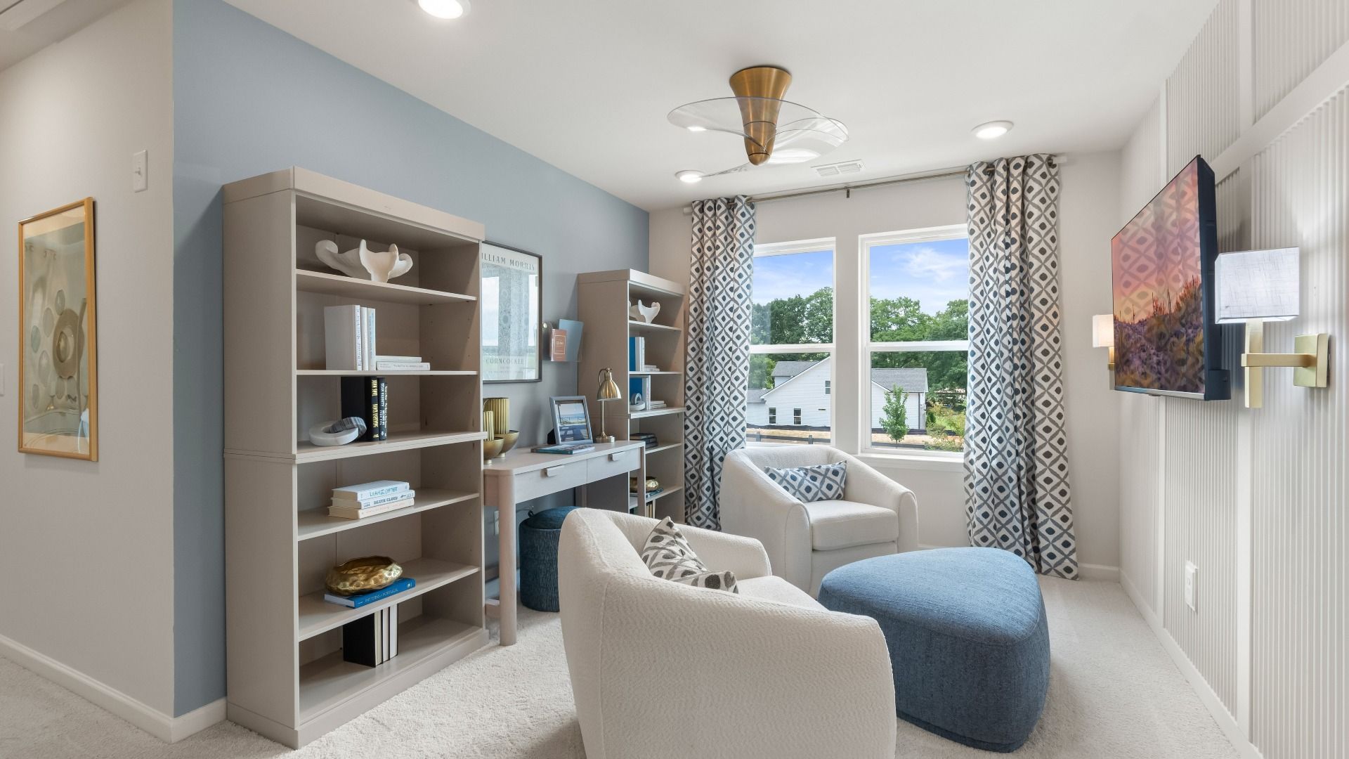 Spacious upstairs loft in new construction townhome for flexible office or lounge use with natural daylight.