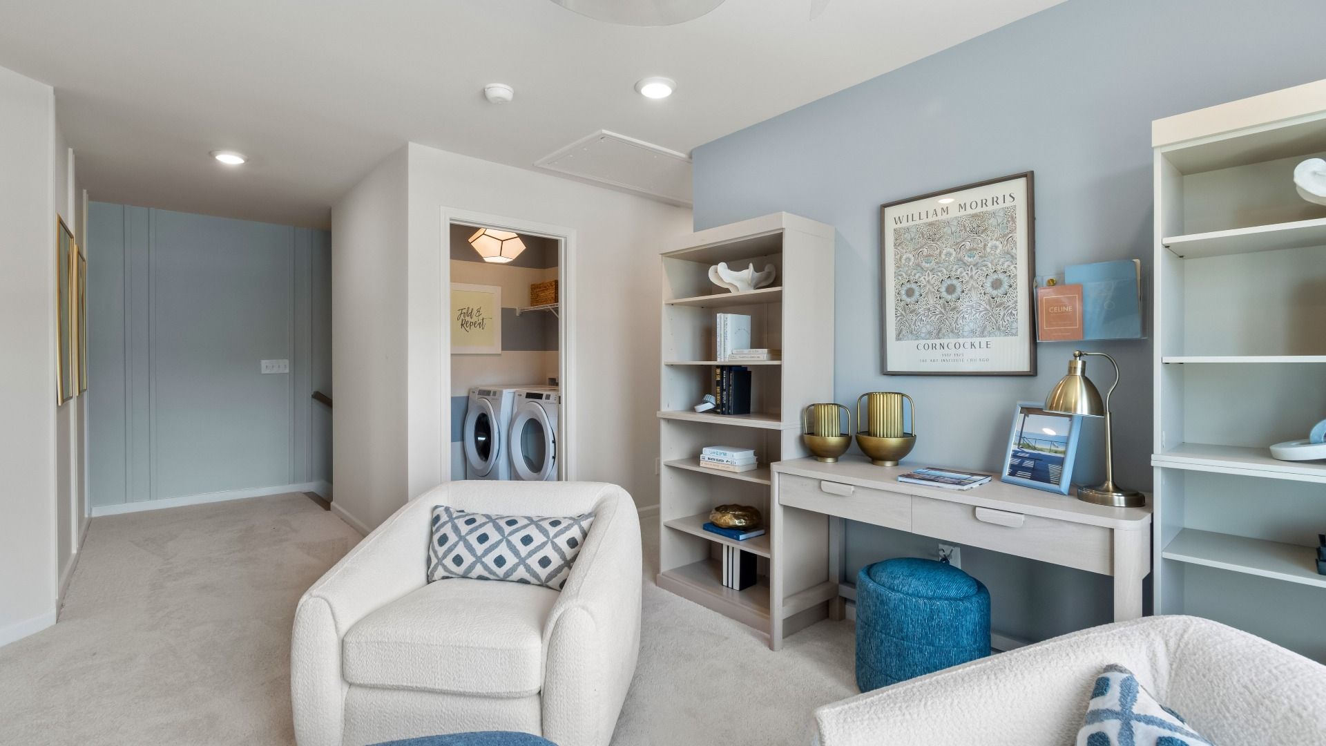 Spacious upstairs loft in new construction townhome for flexible office or lounge use with natural daylight.