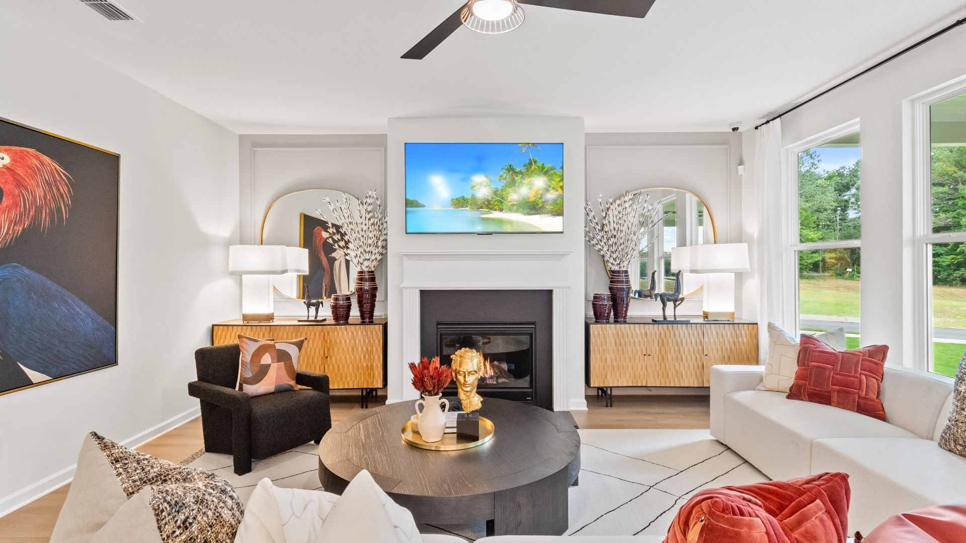 Spacious family room featuring a central fireplace, large windows, and modern design in Hamilton Lakes single family home.