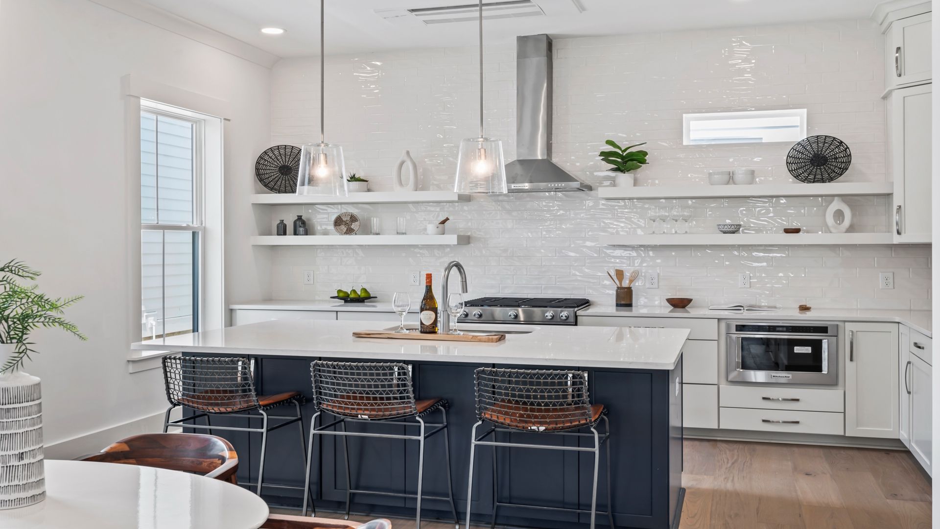 The Sullivan model home features a chef-inspired kitchen with a large island, designer finishes, and open-concept flow.