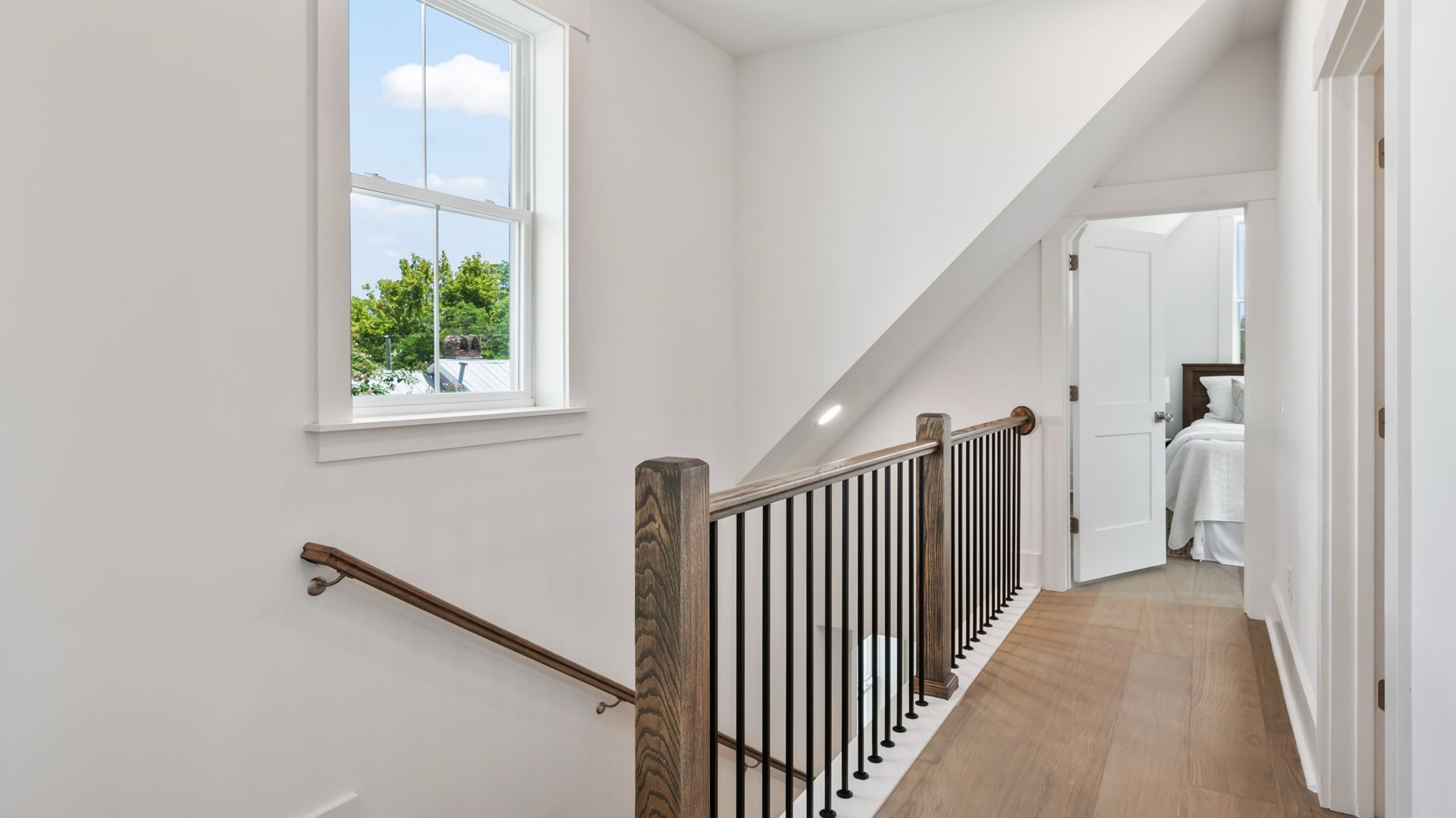 Third-floor hallway in the Sullivan home plan featuring hardwood flooring and access to secondary bedrooms.