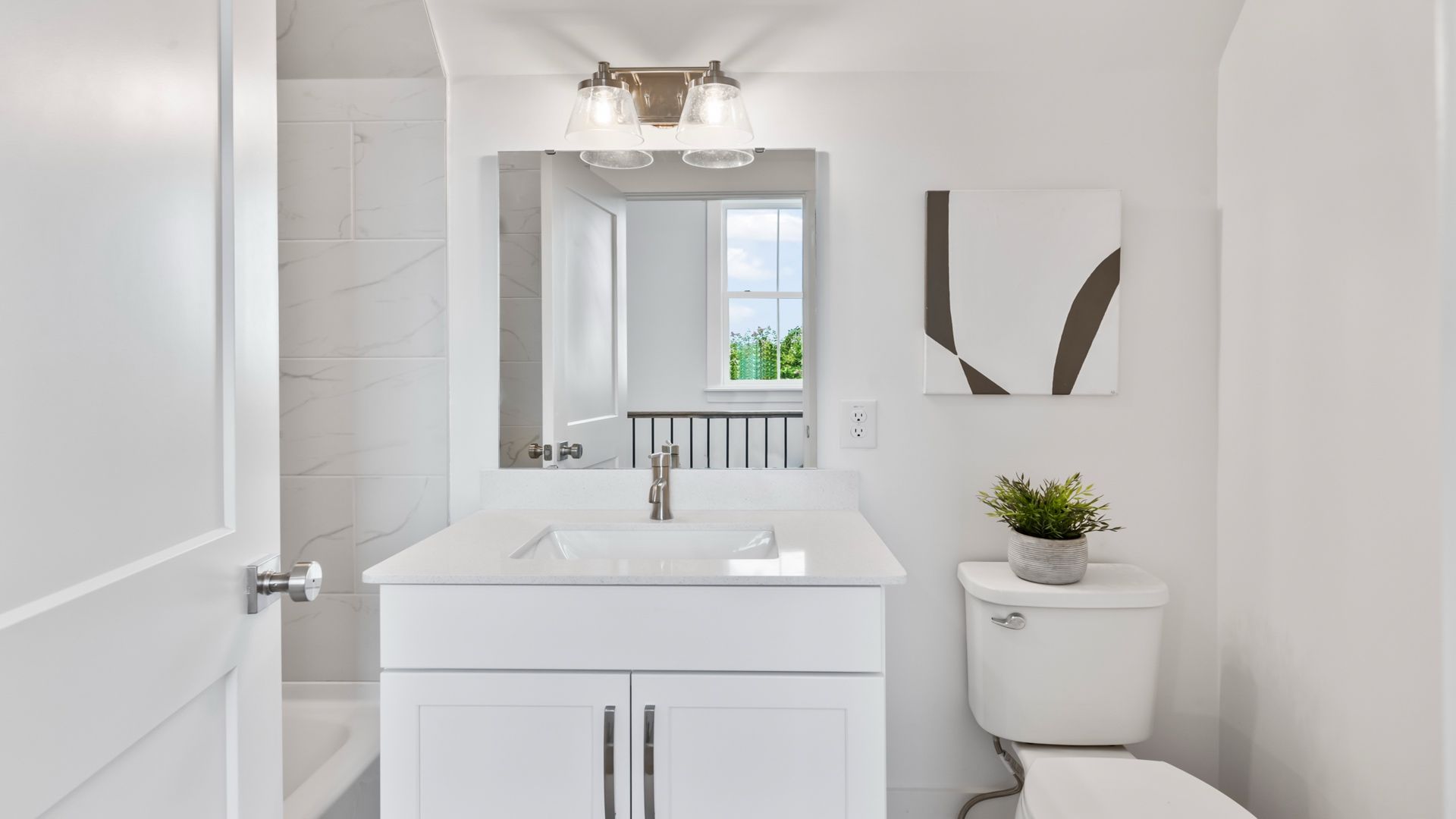 Secondary bathroom in the Sullivan home plan with modern fixtures and bright finishes.
