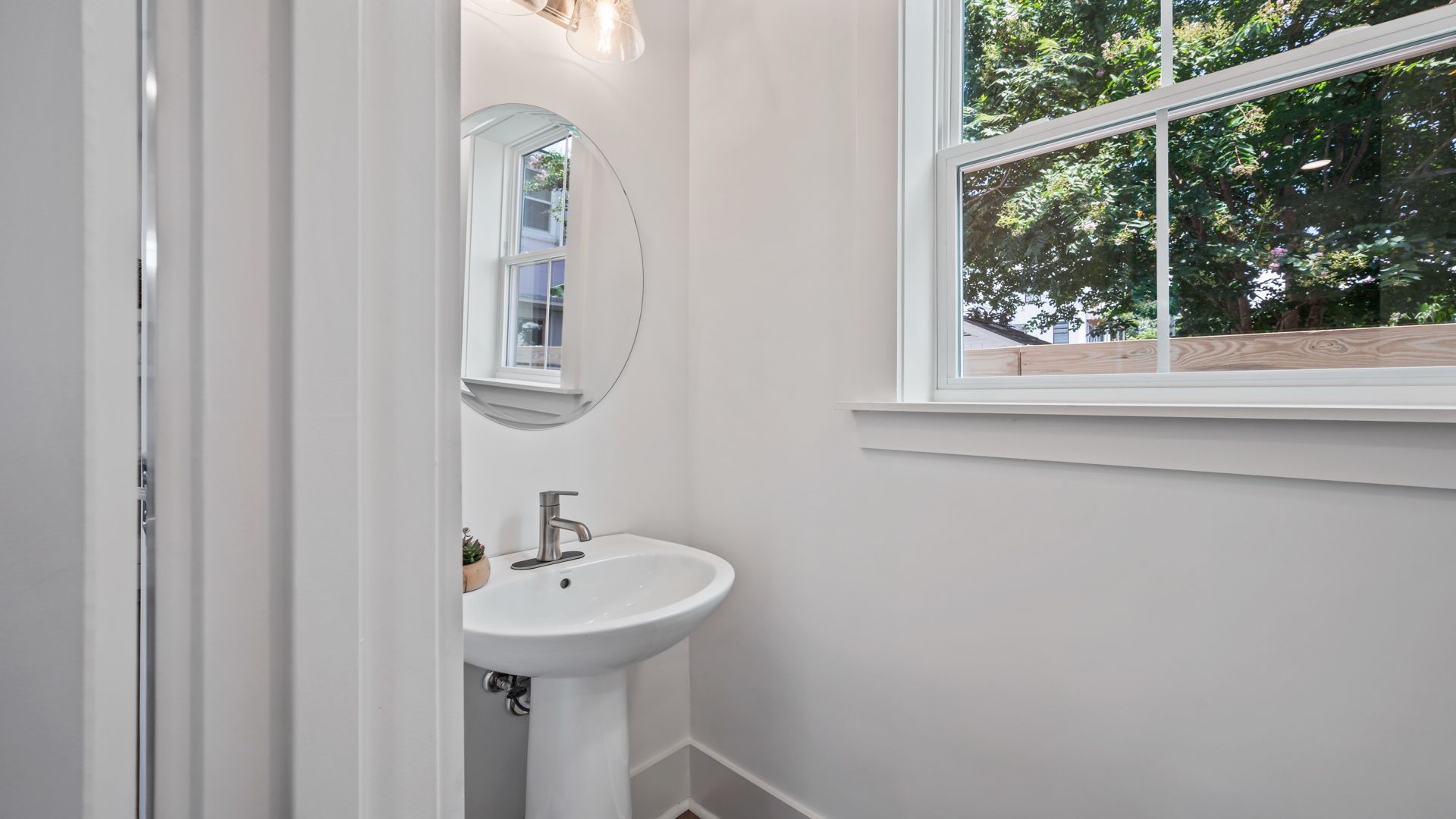 Convenient powder room in the Sullivan home plan with modern fixtures and elegant details.