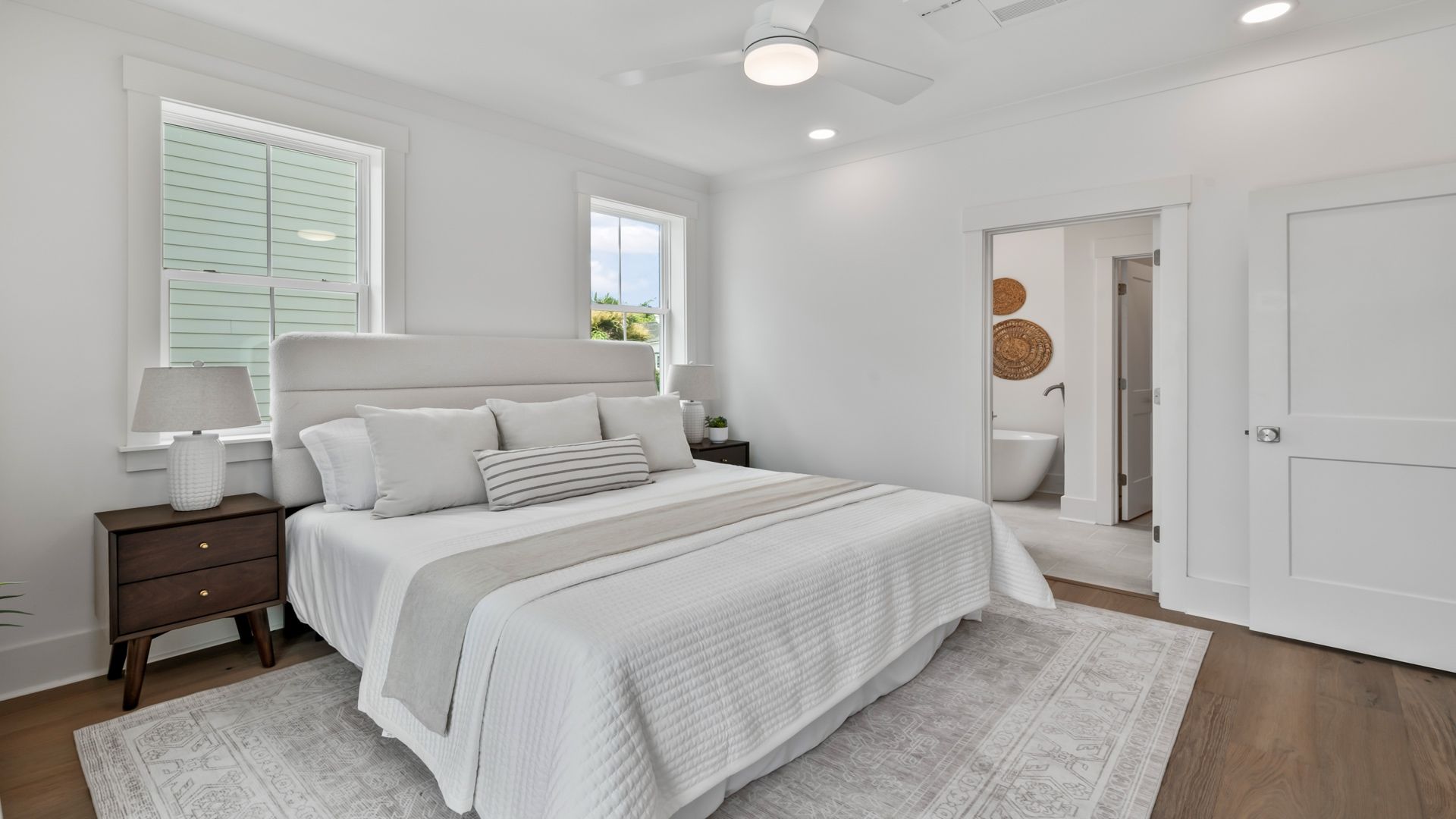 The Sullivan primary suite offers a spacious retreat with stylish finishes and abundant natural light.