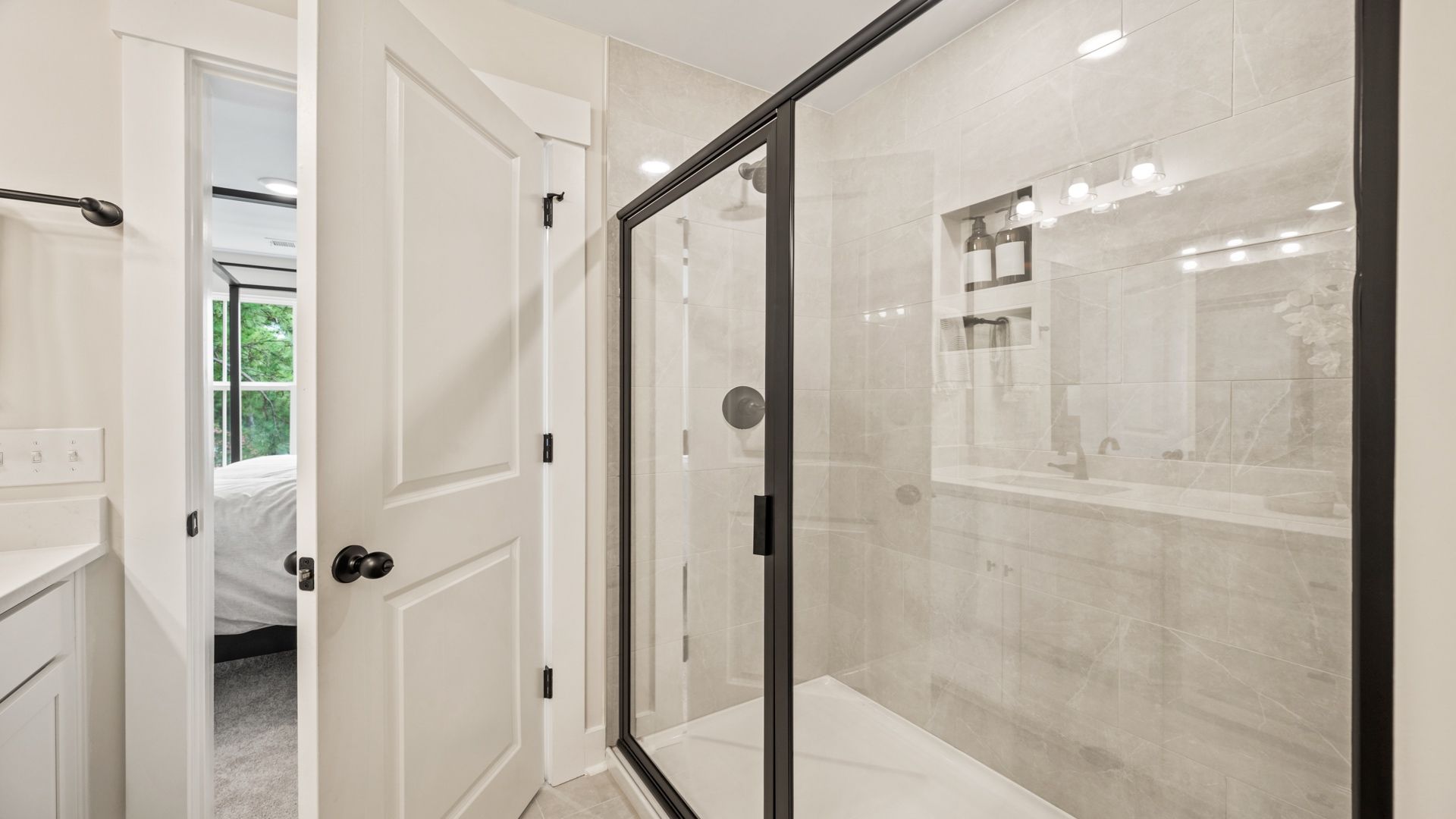 Glass-enclosed shower in the Jennings primary bathroom