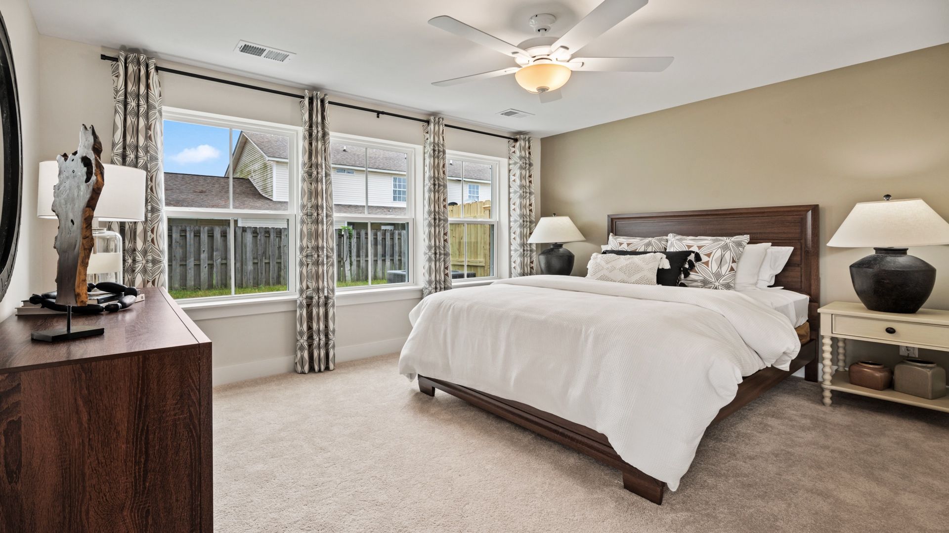 First-floor bedroom with plush carpet and natural light