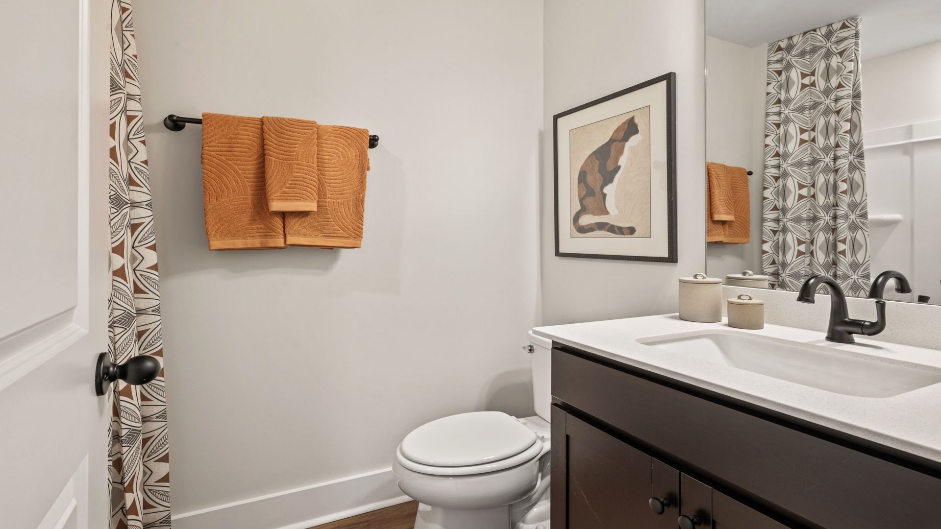 Stylish first-floor bathroom with vanity and tub/shower combo
