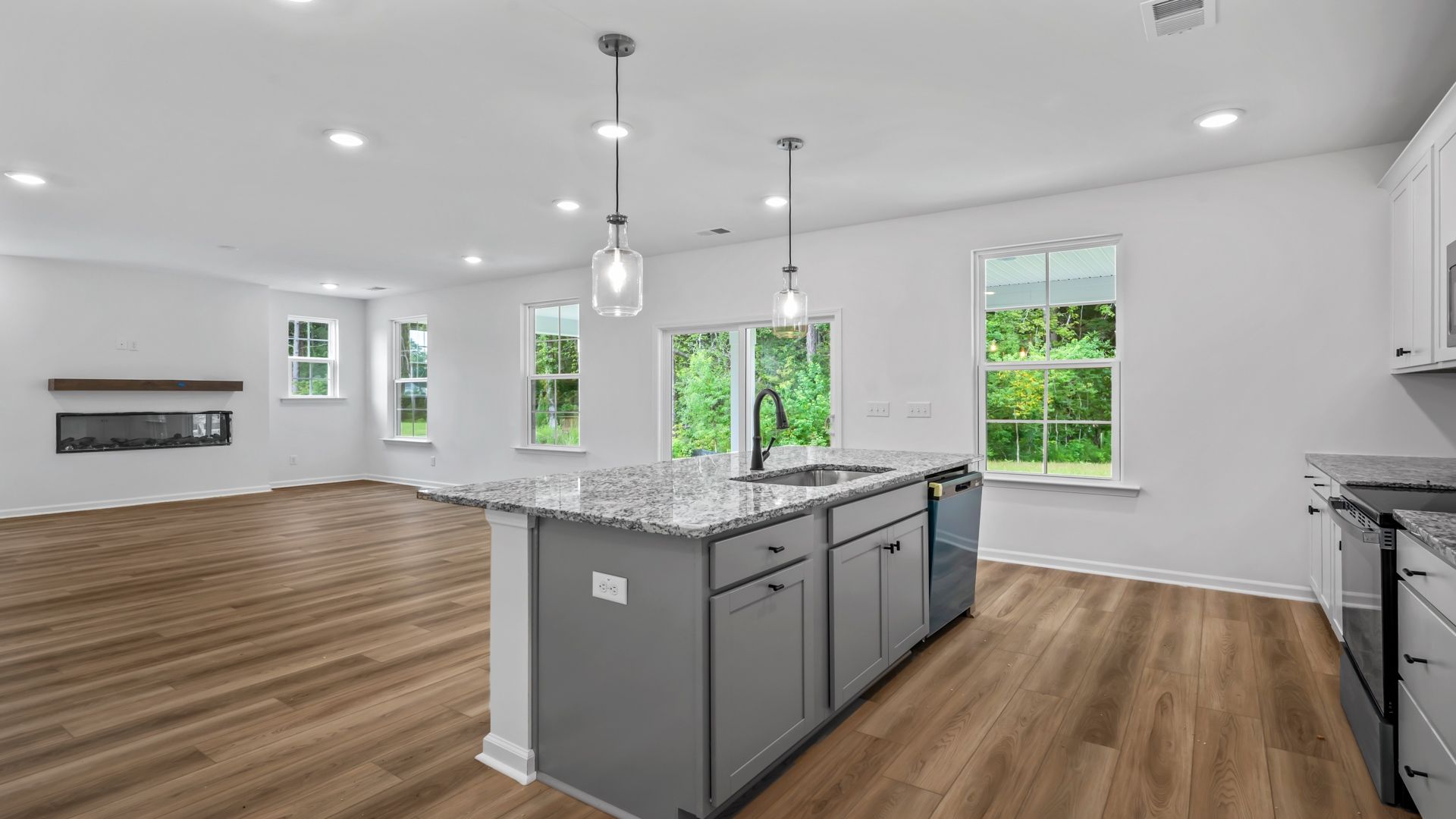 Spacious open layout connects the kitchen and living