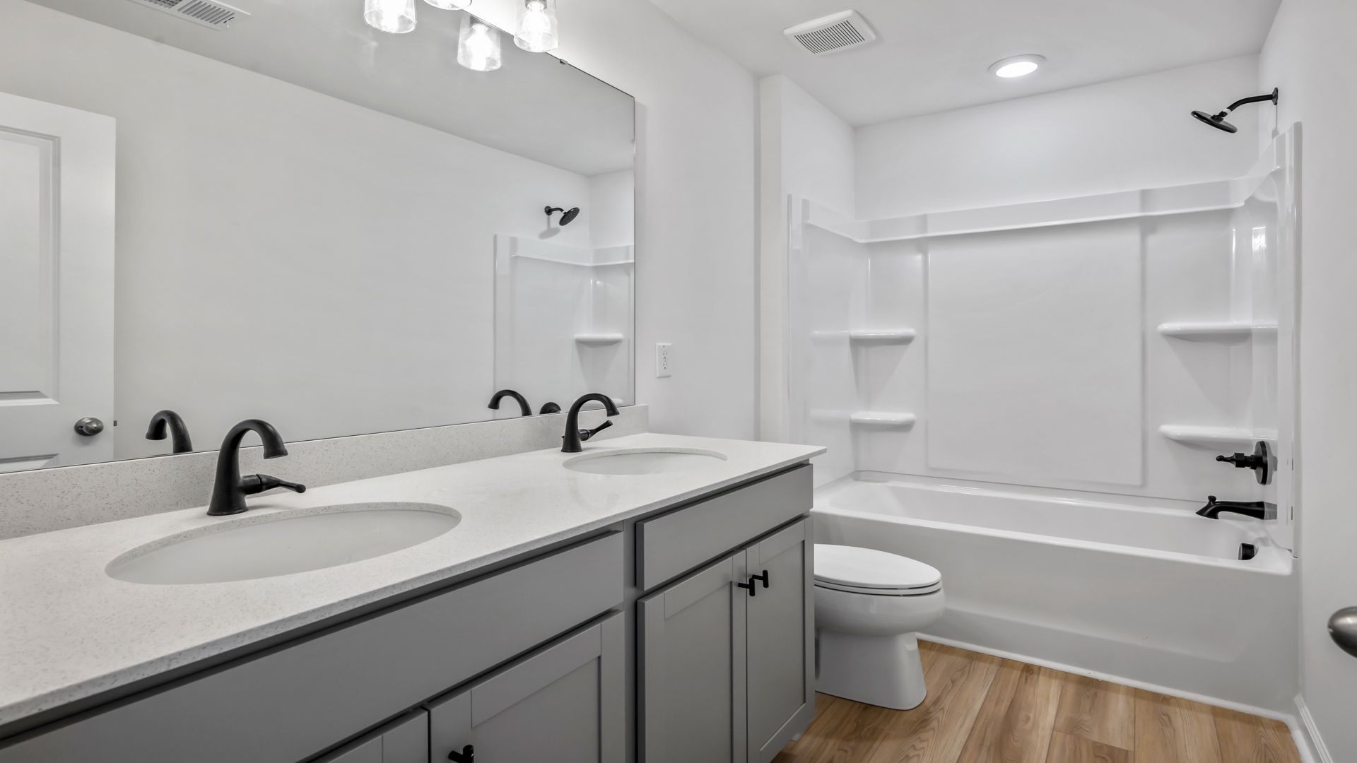 The Pritchard’s secondary bath features a dual vanity and tub