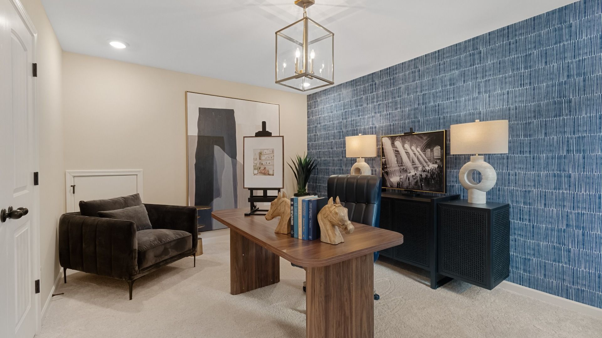 Spacious bedroom or office space featuring abundant natural light from large window in new construction home.