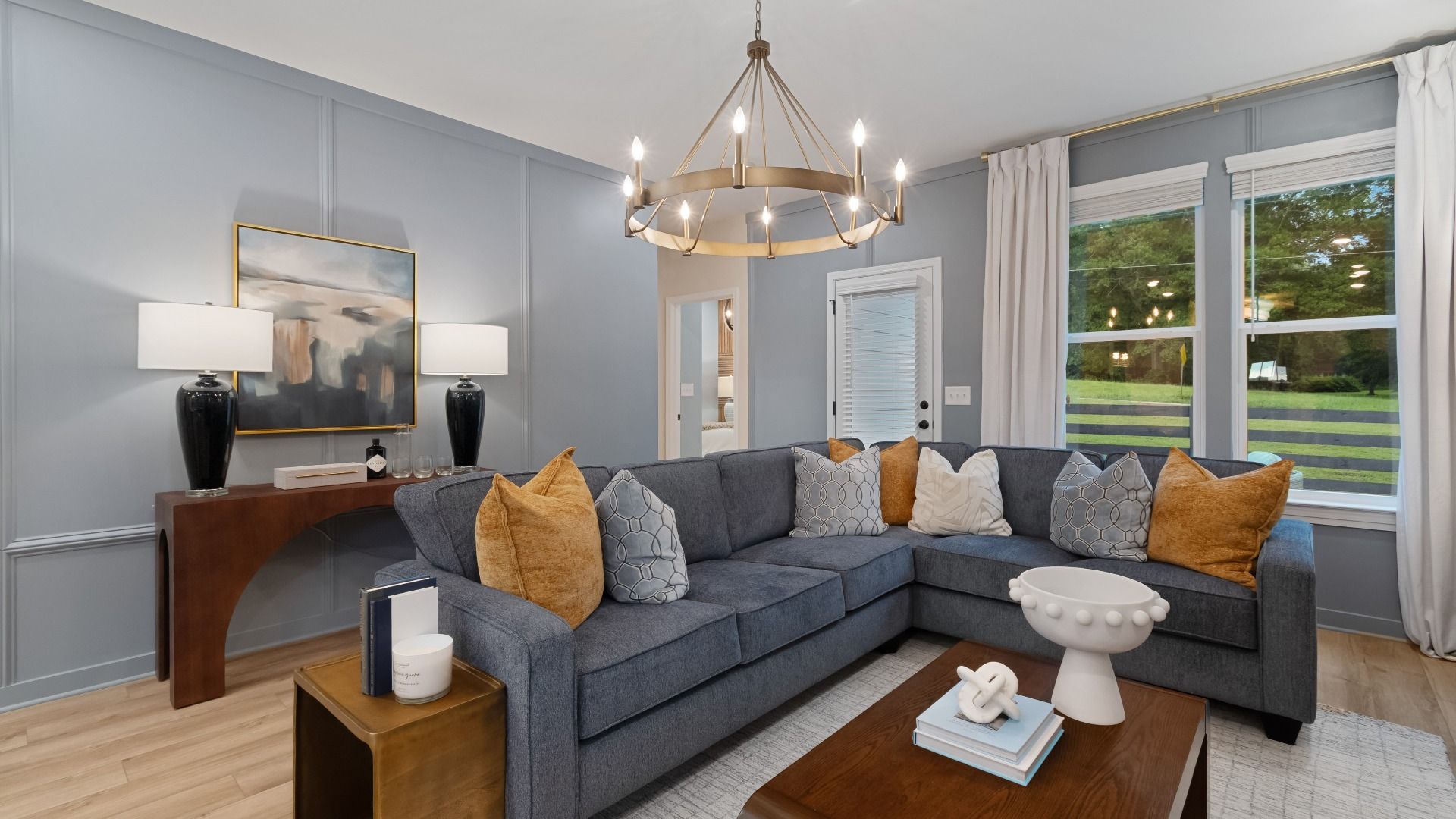 Spacious family room with abundant natural light, LVP floors, and open layout to adjacent kitchen.