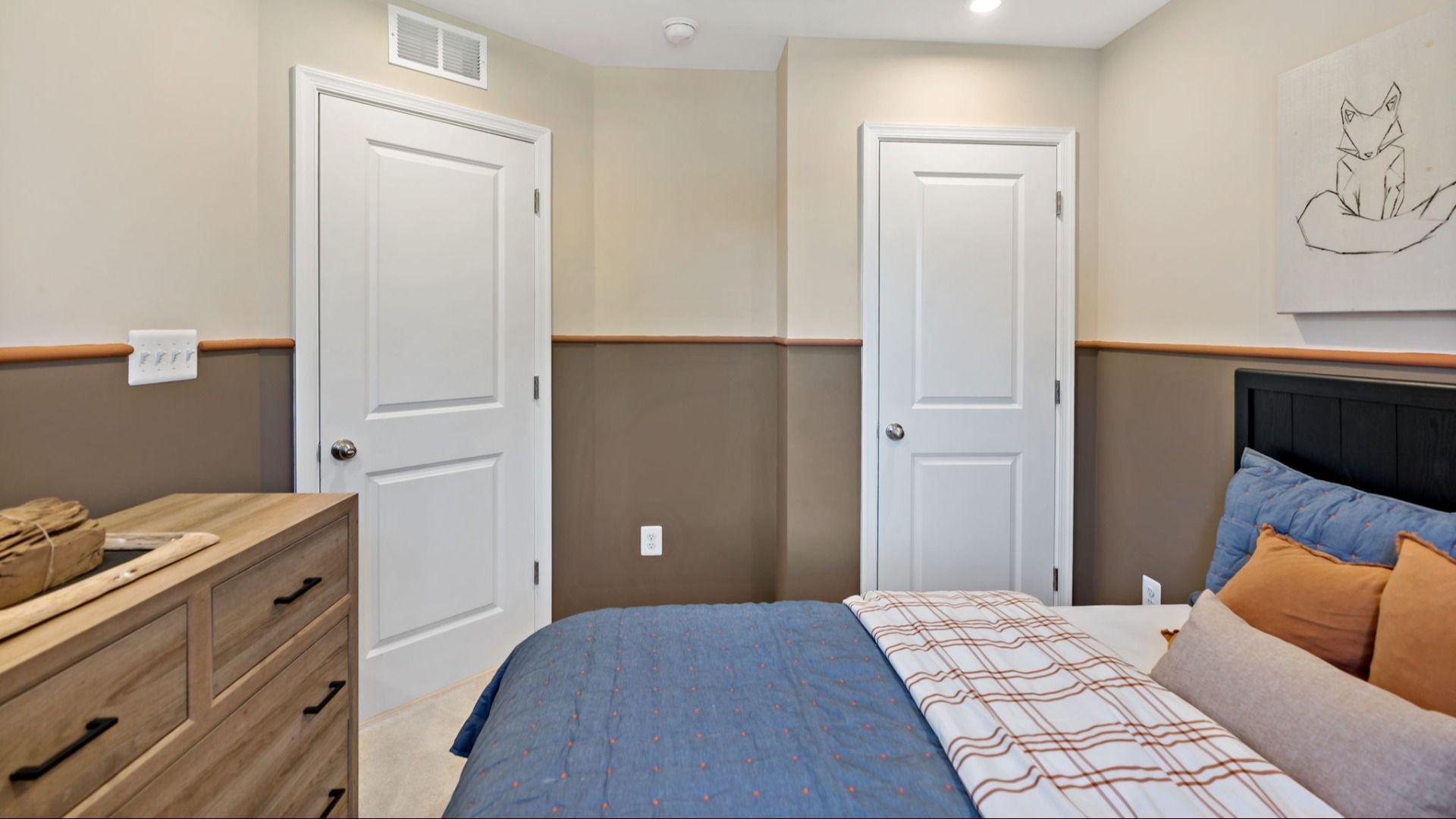 A bright and functional second bedroom with an attached closet for convenient bedroom storage.