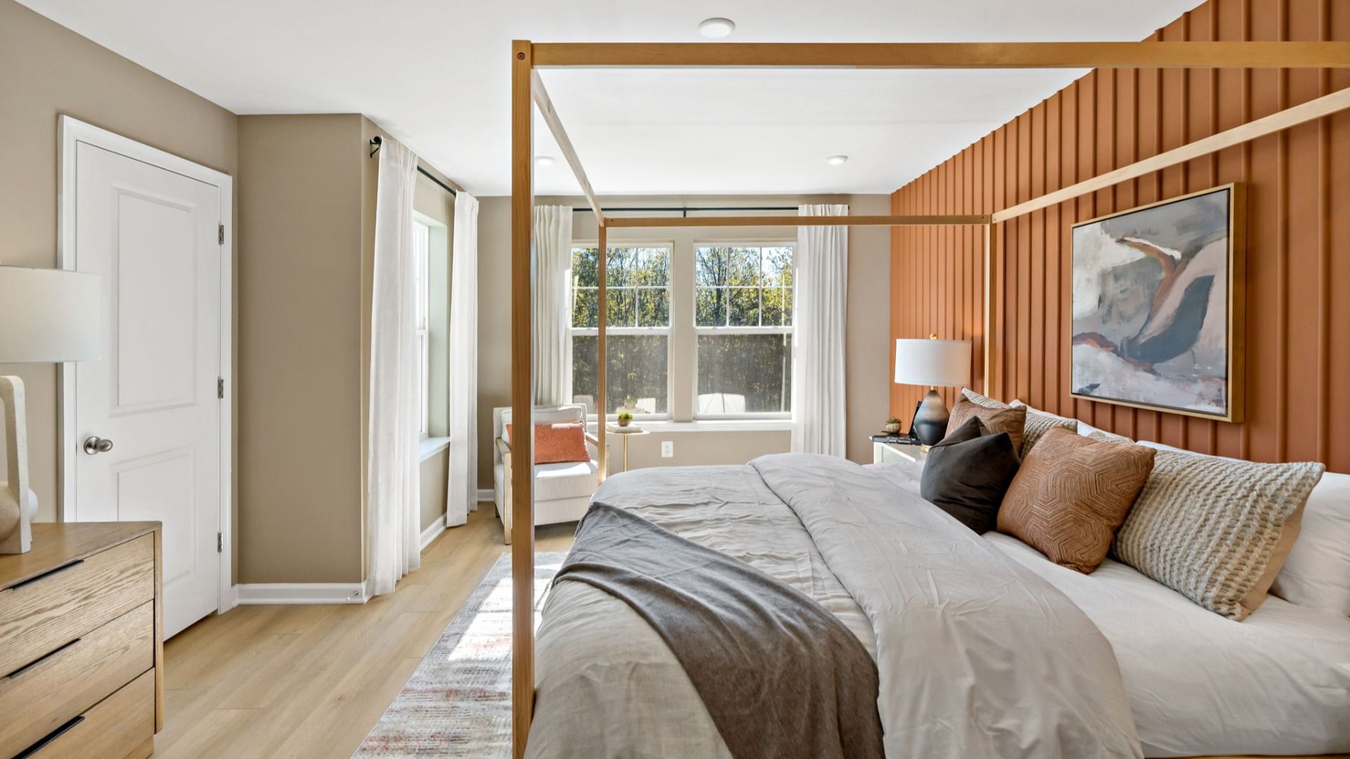 Enjoy the owner’s suite with cozy accents, a large window, and an attached bathroom.
