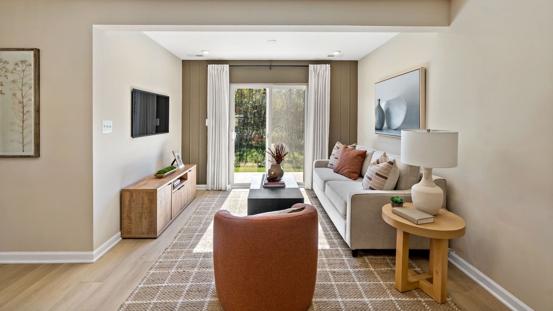 Bright and cozy living room featuring a sliding glass door for natural light and outdoor access.
