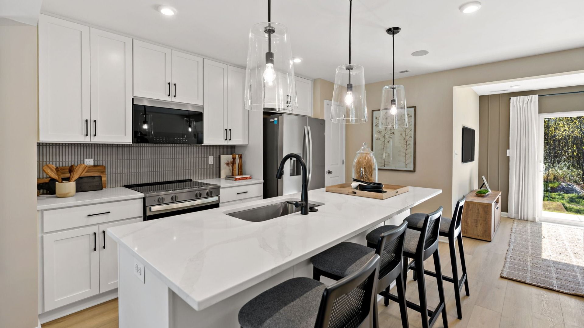 Spacious kitchen with an island providing ample room for bar seating and meal prep.