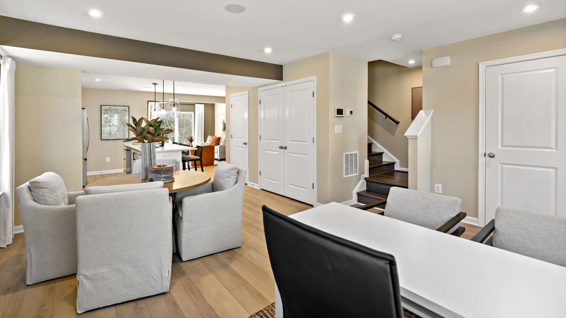Enjoy the dining area in this open-concept floor plan, complete with convenient storage options.