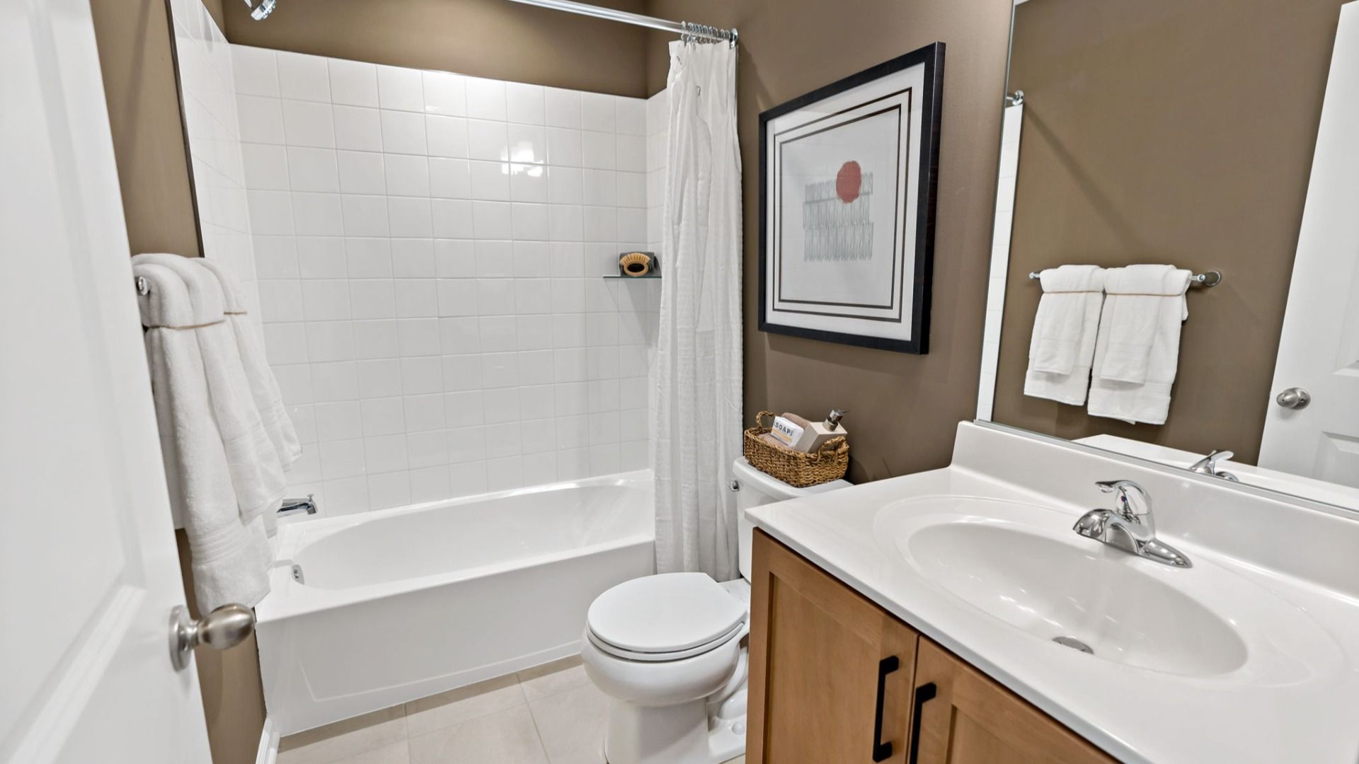Madison II second-level bathroom with a sleek sink, modern shower, and convenient layout.