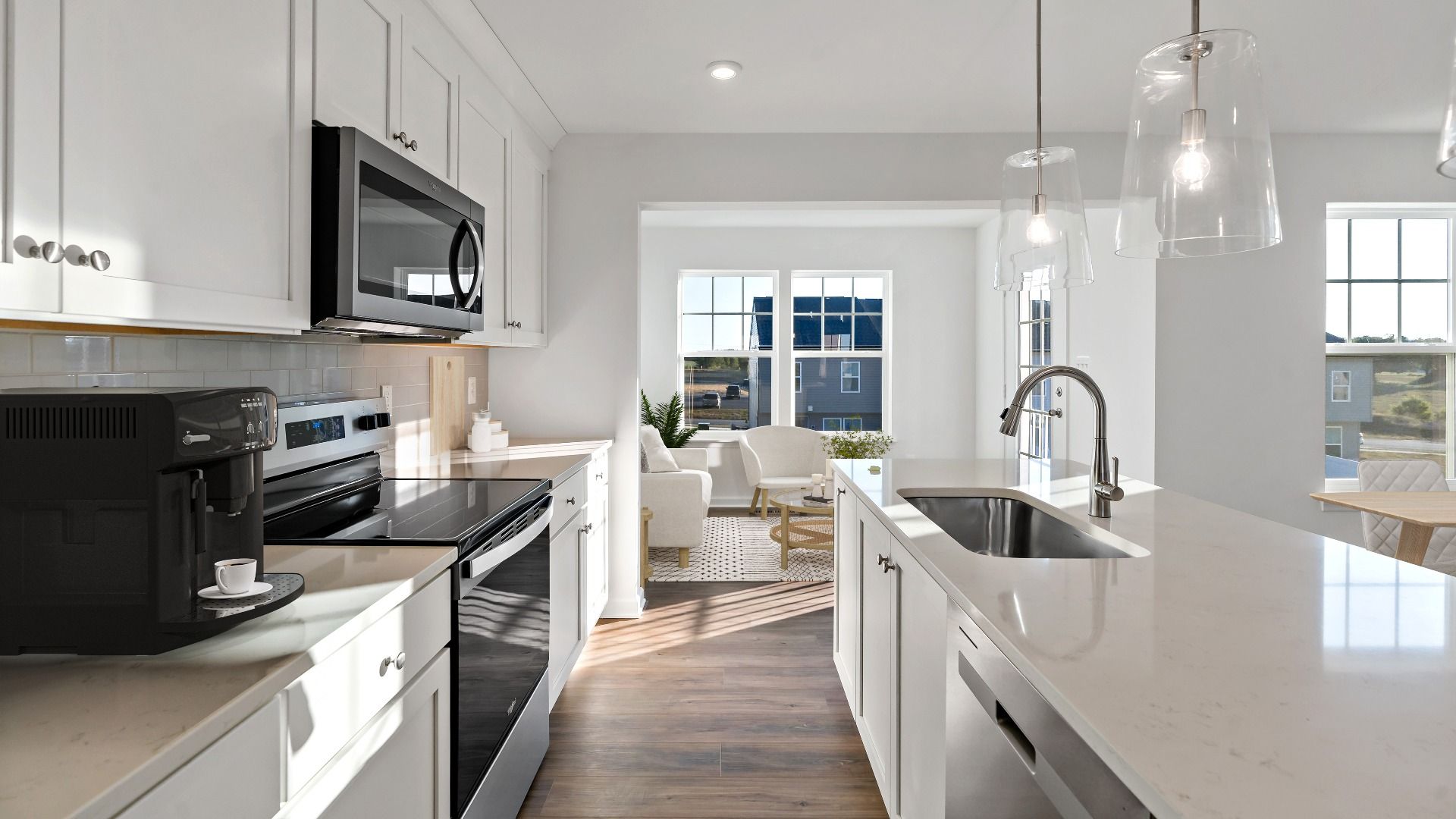 Open concept kitchen layout with modern design and flow in the York II Garage floor plan.