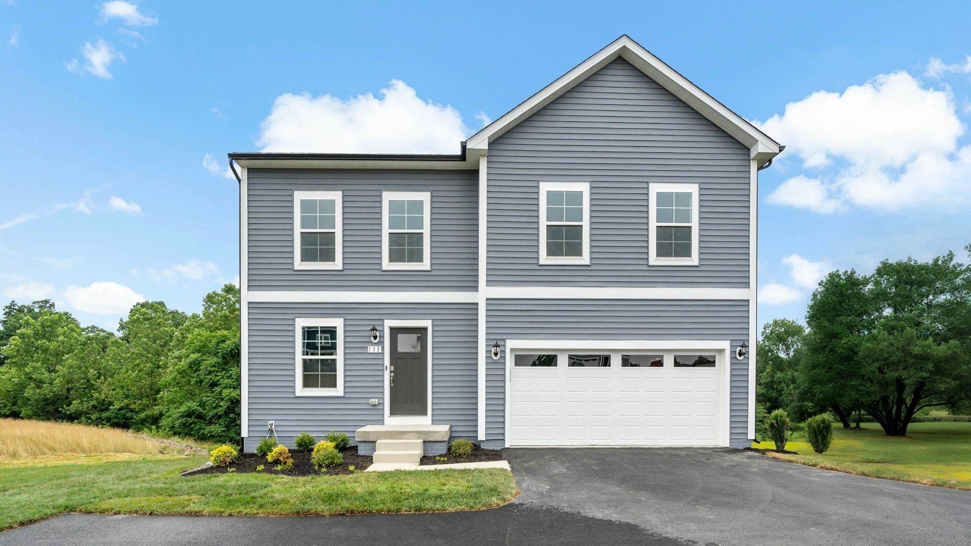 Exterior elevation 1 on the Whitehall II with grey siding.