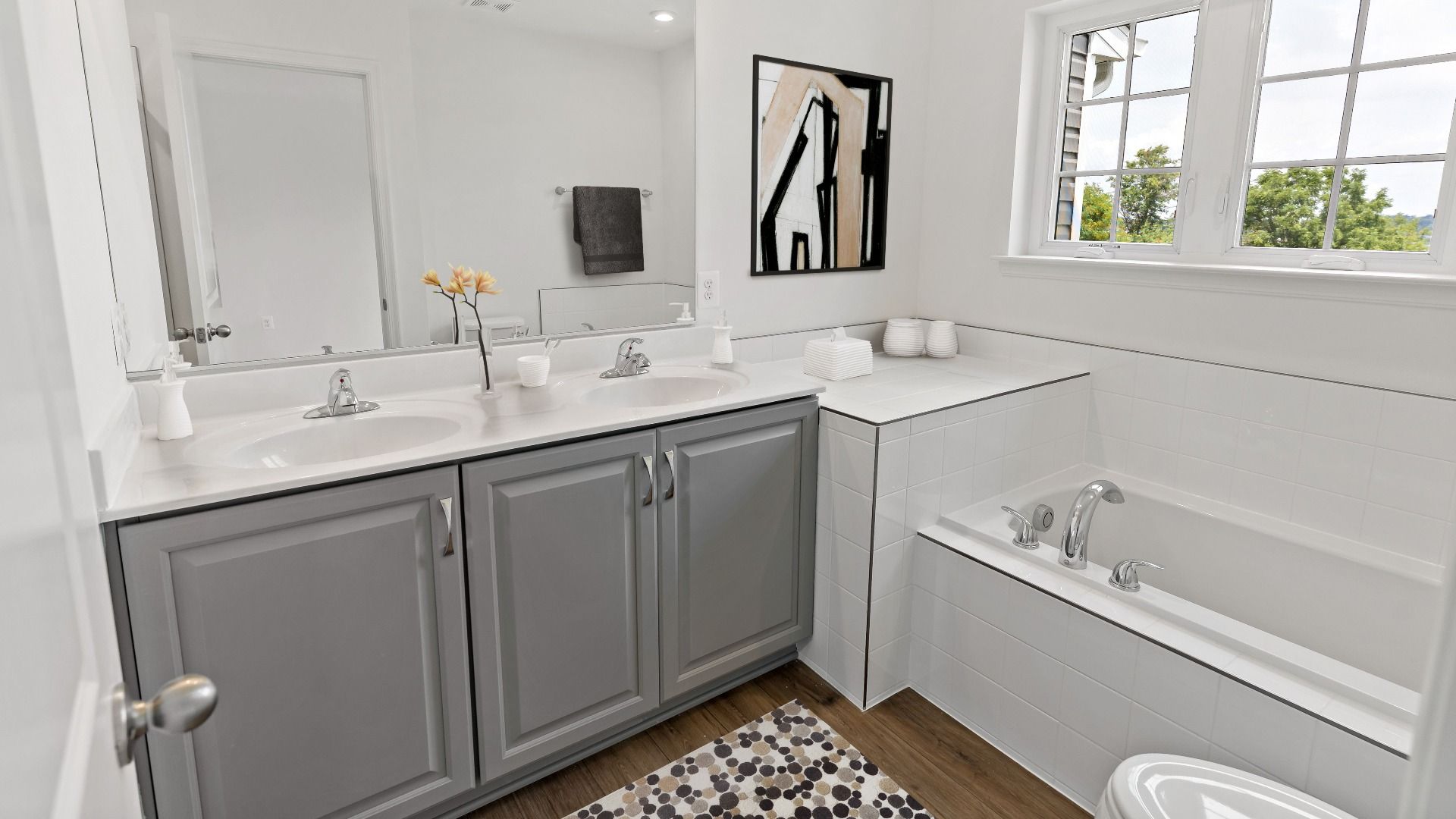Owners bathroom in the York II Garage floor plan with sleek dual sink and modern features.