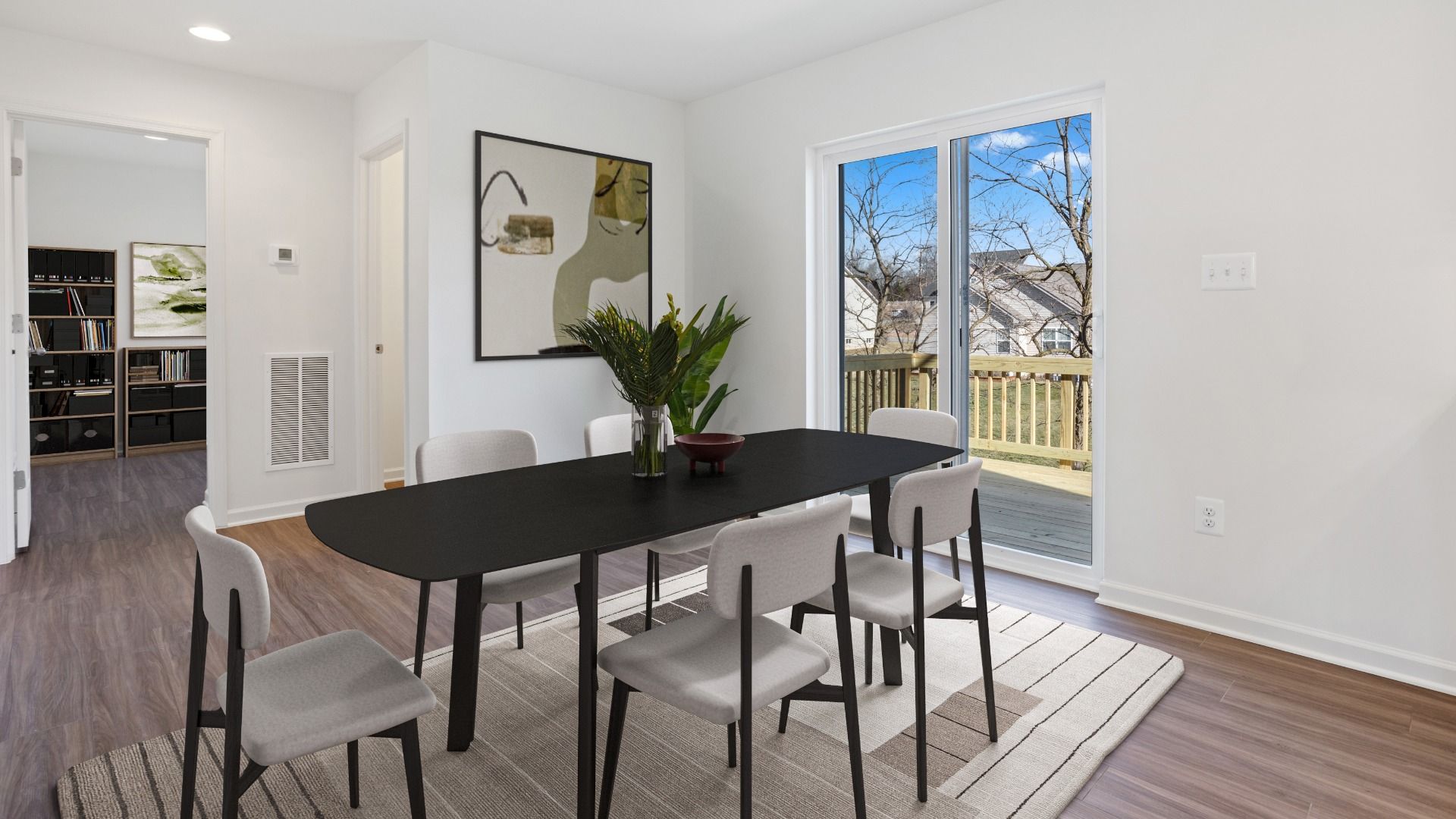 Dining area in the Whitehall II with sliding glass door access to outdoor deck.