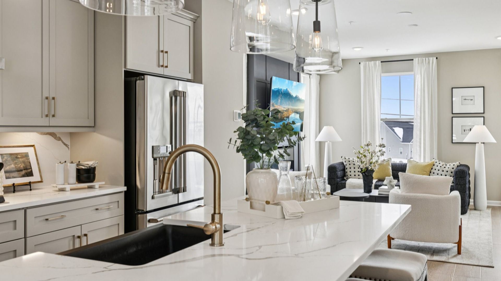 Designer finishes appoint The Bradford kitchen, featuring a striking black farmhouse sink as its bold focal point.